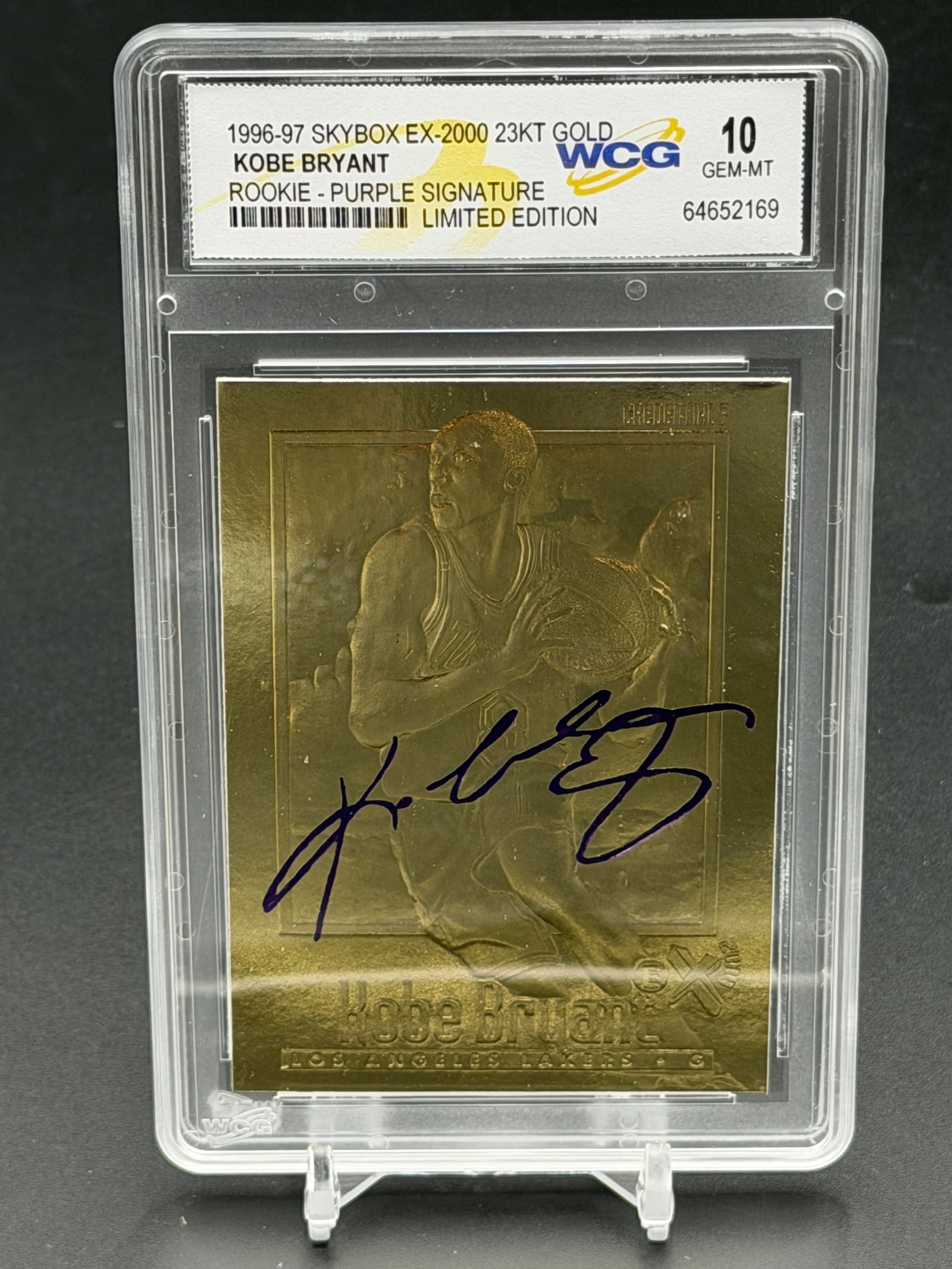 1996-97 SkyBox EX-2000 23KT Gold Kobe Bryant Purple Signature WCG 10 Rookie Card Serial #31963: An exceptional sports collectible: a pristine WCG GEM MINT 10 example of Kobe Bryant’s 1996–97 Skybox EX–2000 "Purple Signature" 23KT gold rookie commemorative. The composition featu