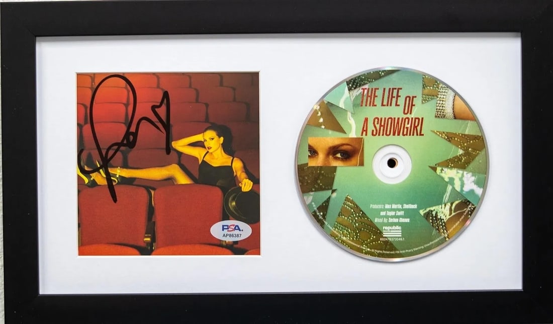 Taylor Swift Signed "Showgirl" CD Framed Presentation/Display Piece PSA COA: Framed signed "The Life of a Showgirl" photo + disc presentation display. Signature appears on the photo; authentication via PSA/DNA (PSA) label/sticker in the display (see photos). Highlights Framed 
