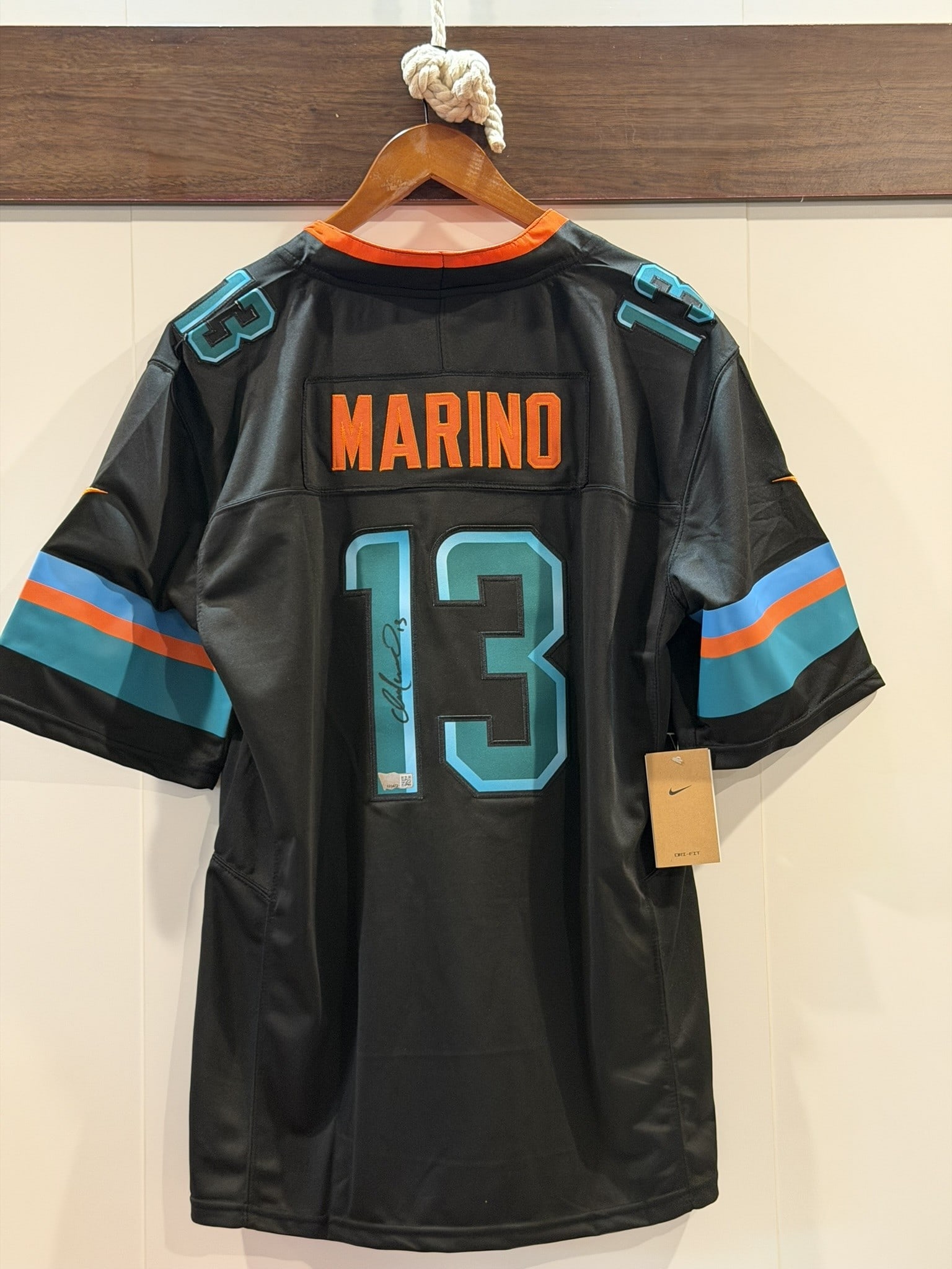 Dan Marino Signed Dolphins #13 Nike NFL Jersey ACE COA Sz L NWT: Official Nike Miami Dolphins NFL jersey personally signed by Dan Marino in black marker across the reverse number "13." The jersey features Marino nameplate, player number 13, Nike On Field constructi