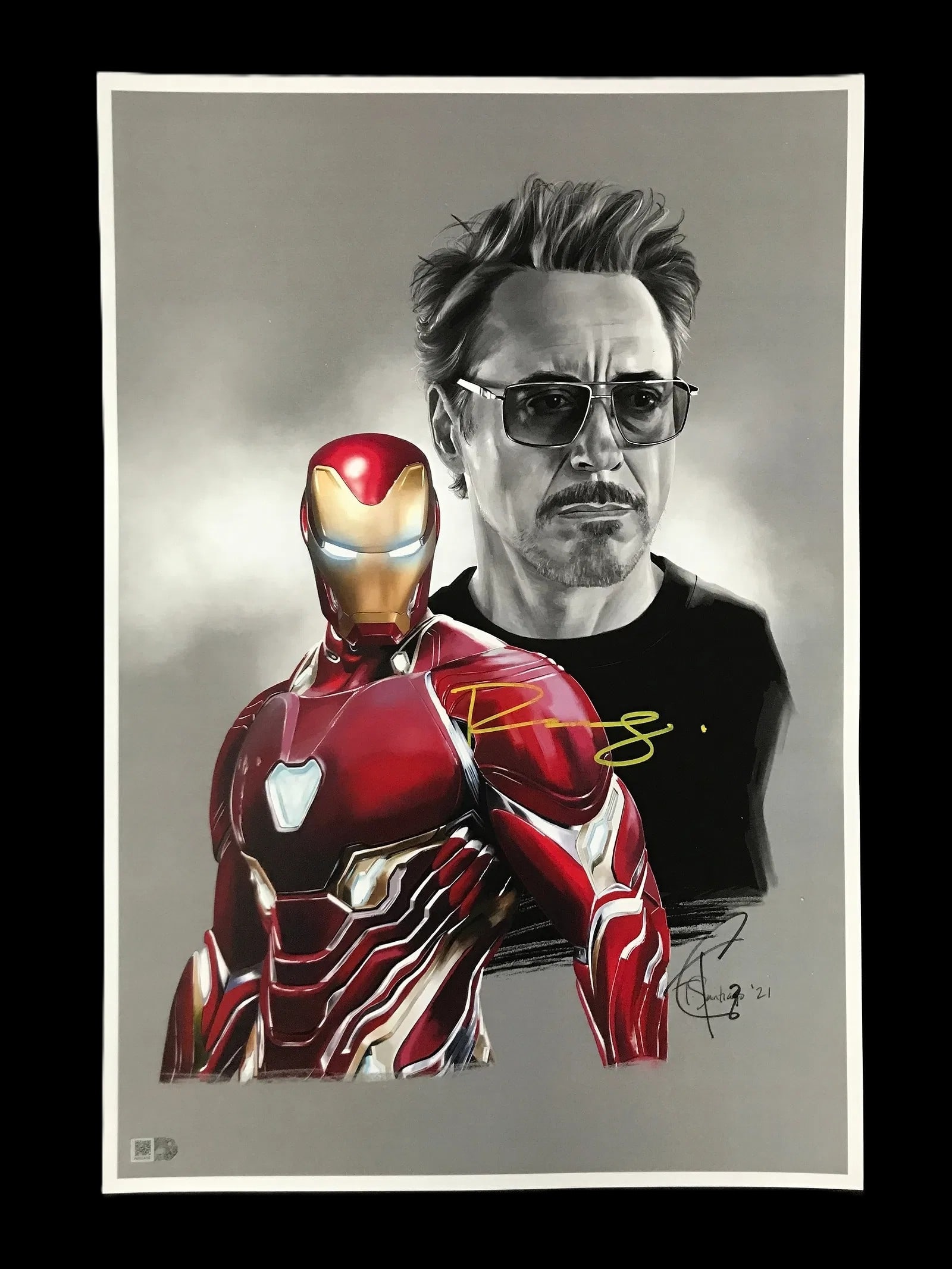 Robert Downey Jr. Signed Iron Man Portrait Lithograph by Tony Santiago w/ COA 11" x 18": An exceptional cinematic collectible: a hand–signed art portrait featuring Robert Downey Jr. as Tony Stark alongside a brilliantly rendered depiction of the Iron Man armor. The composition prese