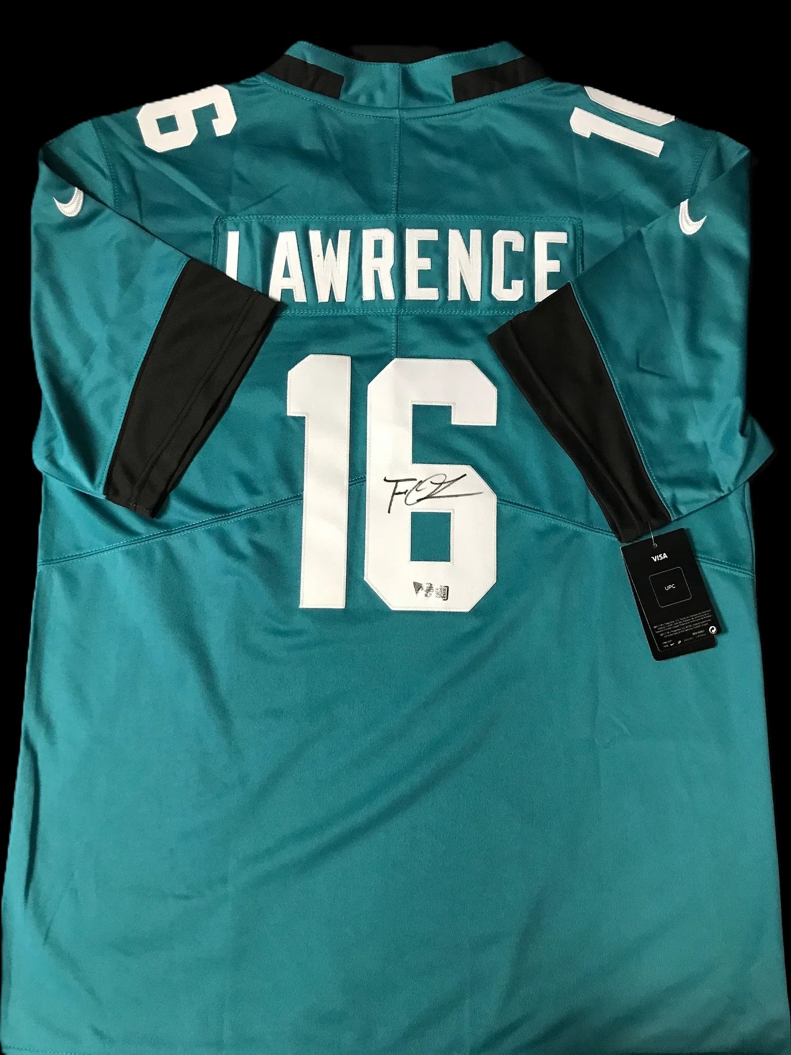 Trevor Lawrence Signed Jacksonville Jaguars Custom Jersey – ACE COA: A Jacksonville Jaguars teal jersey signed by quarterback Trevor Lawrence. The signature appears in black ink on the back numeral and is authenticated by ACE COA. As the first overall pick in the 2021 