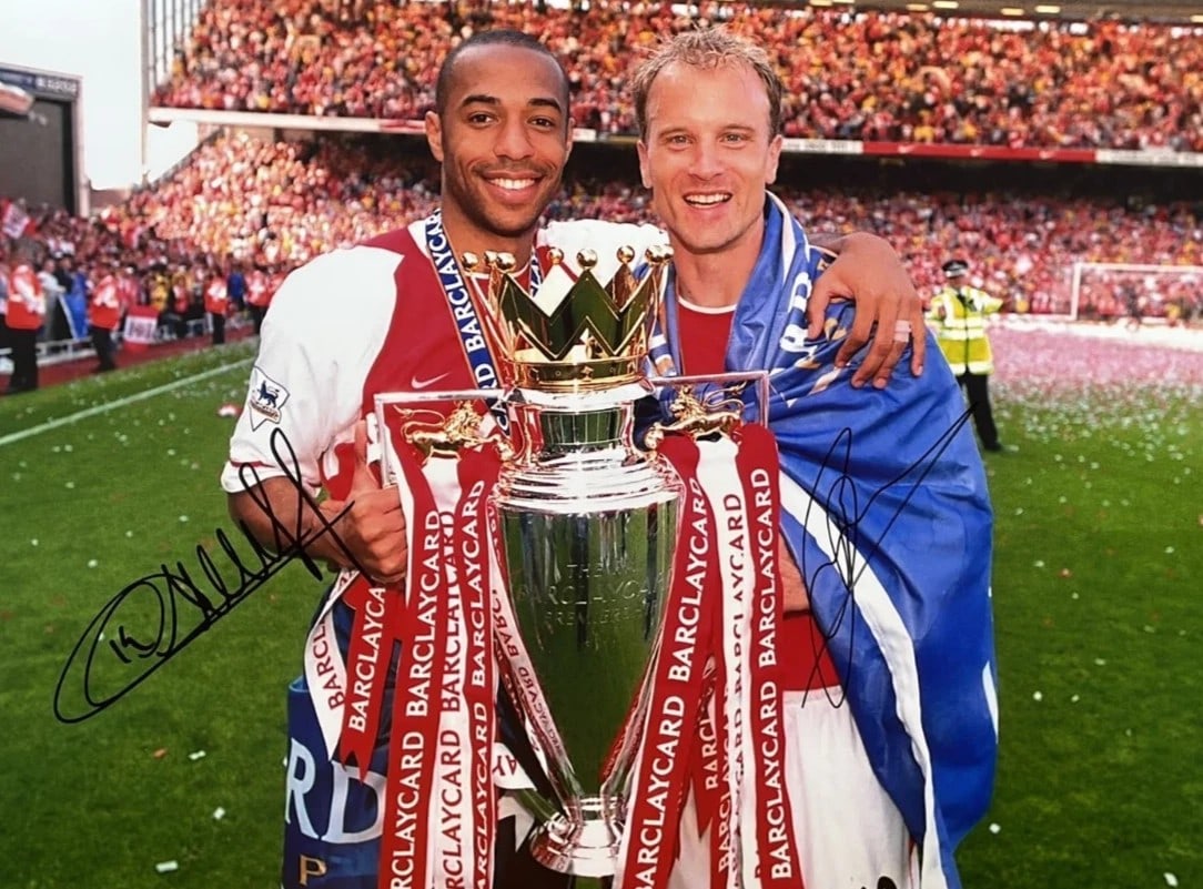 Thierry Henry & Dennis Bergkamp Signed Arsenal Invincibles Photo PSA & CelebCoa COAs 16" × 12": Official 16" × 12" Arsenal Invincibles celebration photograph personally signed by Thierry Henry and Dennis Bergkamp in black marker. The image captures the Arsenal legends celebrating with the Premi