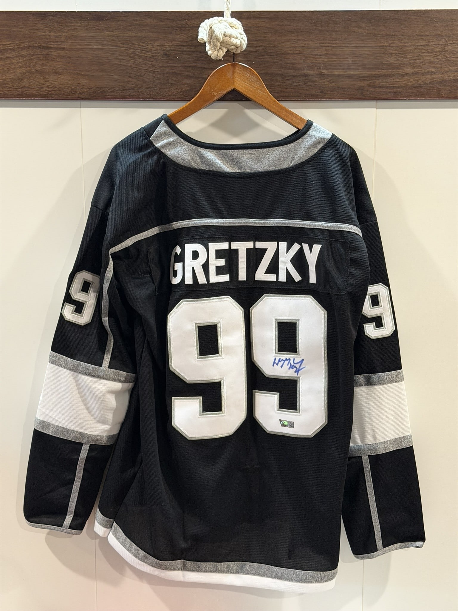 Wayne Gretzky Signed Los Angeles Kings Jersey – Captain "C" – ACE COA: A Los Angeles Kings black alternate–style jersey signed by hockey legend Wayne Gretzky, featuring the iconic number 99 and captain’s "C." The bold blue signature appears on the back numera