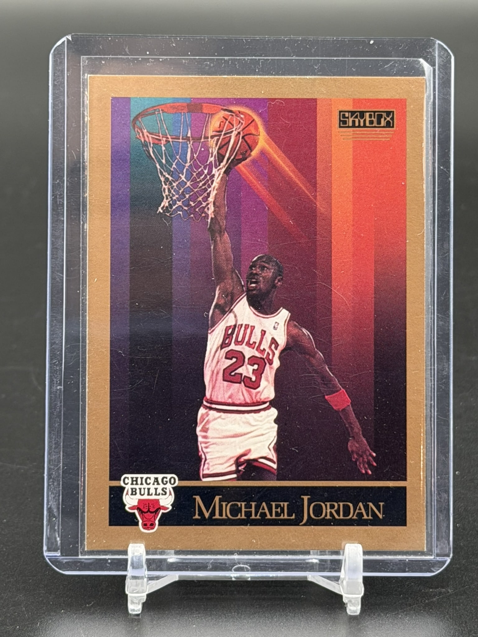 1990 SkyBox Michael Jordan Rookie Era Card #41 Chicago Bulls Vintage Basketball Legend: Vintage 1990 SkyBox Michael Jordan card #41 featuring the Chicago Bulls Hall of Famer. This iconic card highlights Jordan during his historic early-career era, showcasing a striking multi-color neon b