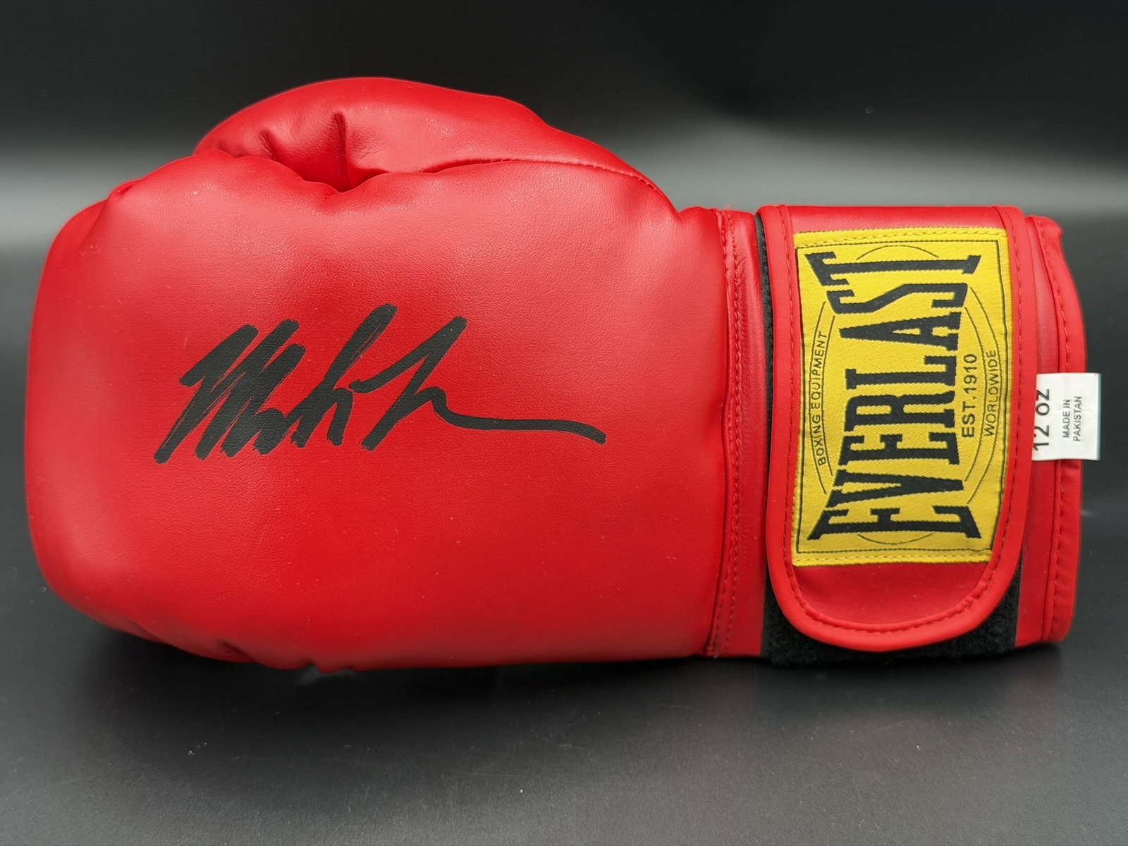 Mike Tyson Signed Red Everlast Boxing Glove WWC COA NWOT: Red Everlast boxing glove personally signed by Mike Tyson in black marker. The glove features Everlast branding and includes a Wide World of Collectibles Certificate of Authenticity (COA) and/or match