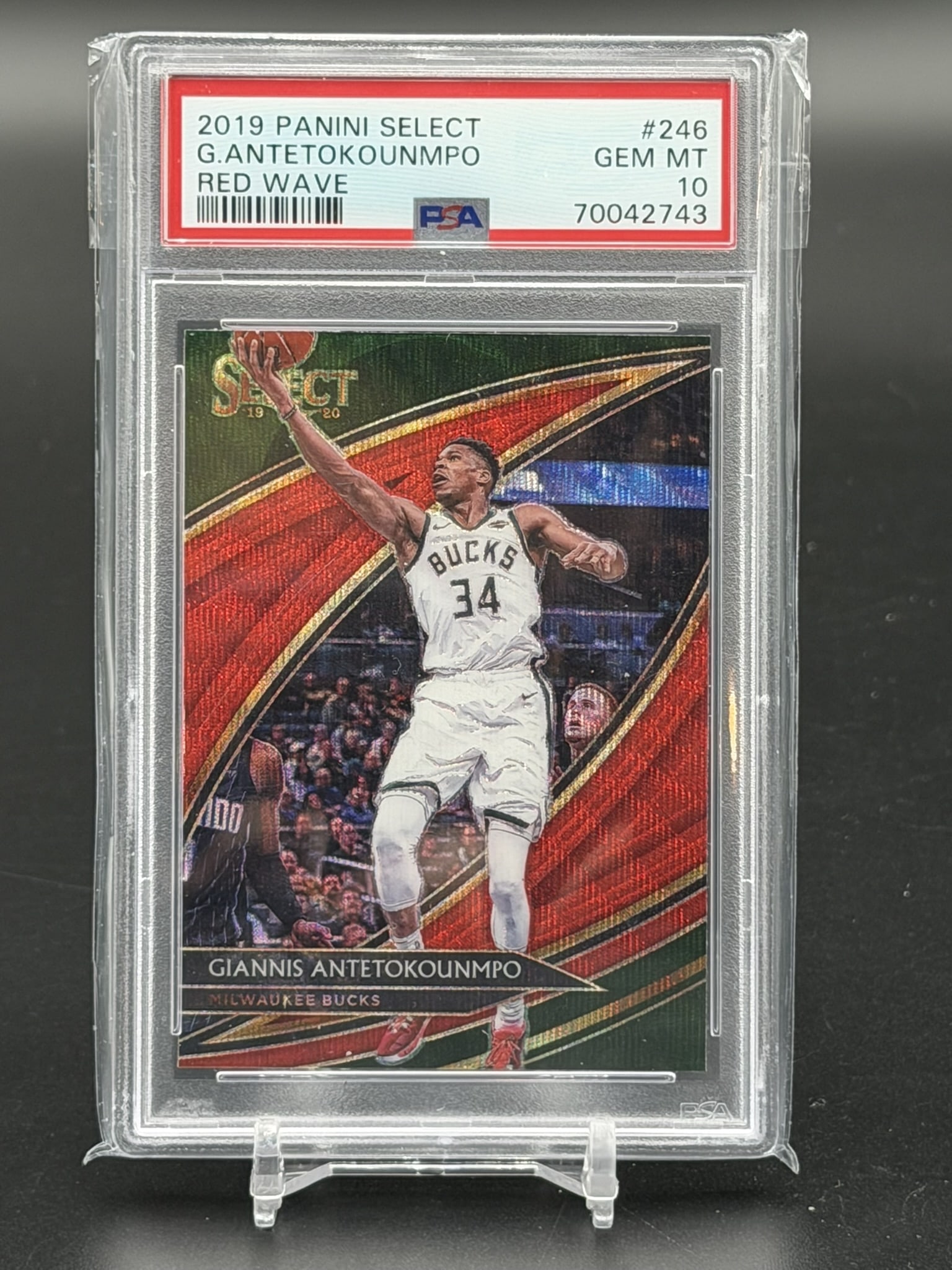 2019 Panini Select Giannis Antetokounmpo Red Wave Prizm #246 Courtside PSA 10 Gem Mint Bucks: 2019 Panini Select Giannis Antetokounmpo Red Wave Prizm card #246, professionally graded PSA Gem Mint 10. This Courtside level tier insert showcases the Milwaukee Bucks superstar going up for a shot o