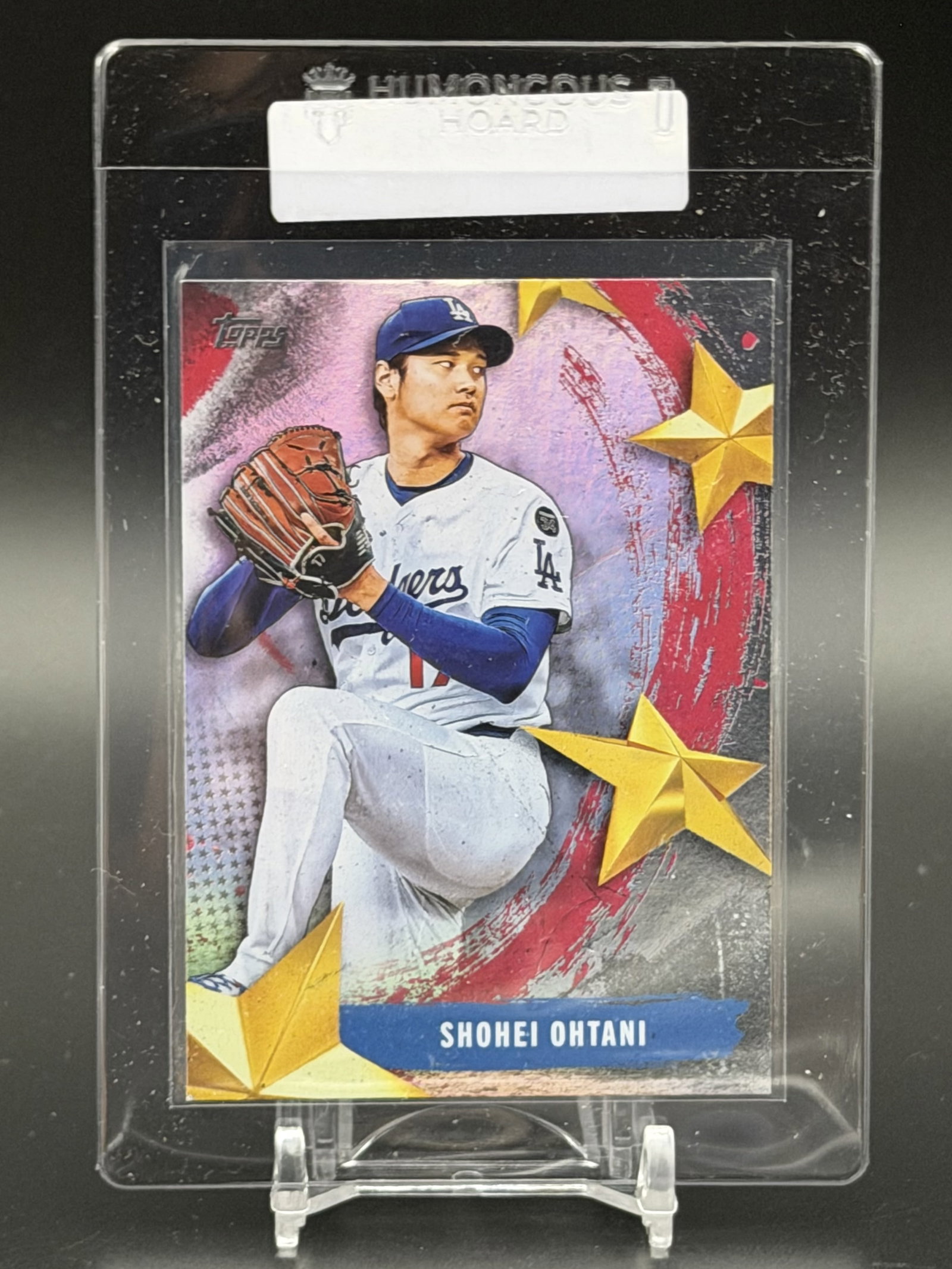 2025 Topps Stars of MLB Shohei Ohtani SMLB-77 Los Angeles Dodgers Insert Card: Official 2025 Topps Stars of MLB insert card featuring Shohei Ohtani of the Los Angeles Dodgers. This colorful insert showcases Ohtani in his Dodgers uniform with the distinctive Stars of MLB foil-ins