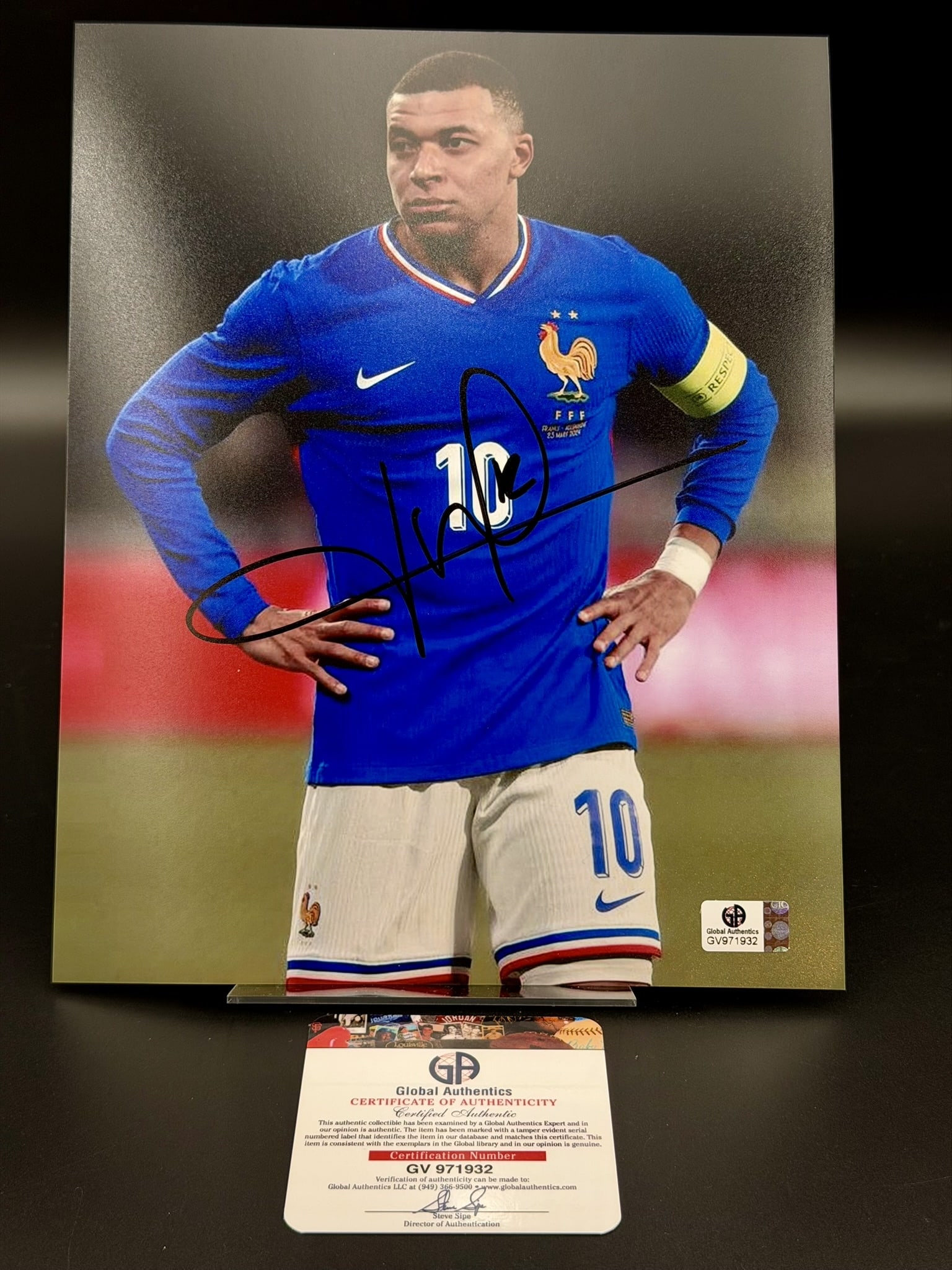 Kylian Mbappé Signed France National Team Photo GA COA 8" × 10": Official 8" × 10" photograph personally signed by Kylian Mbappé in bold black marker while wearing the France national team kit. The photograph includes the original Global Auth