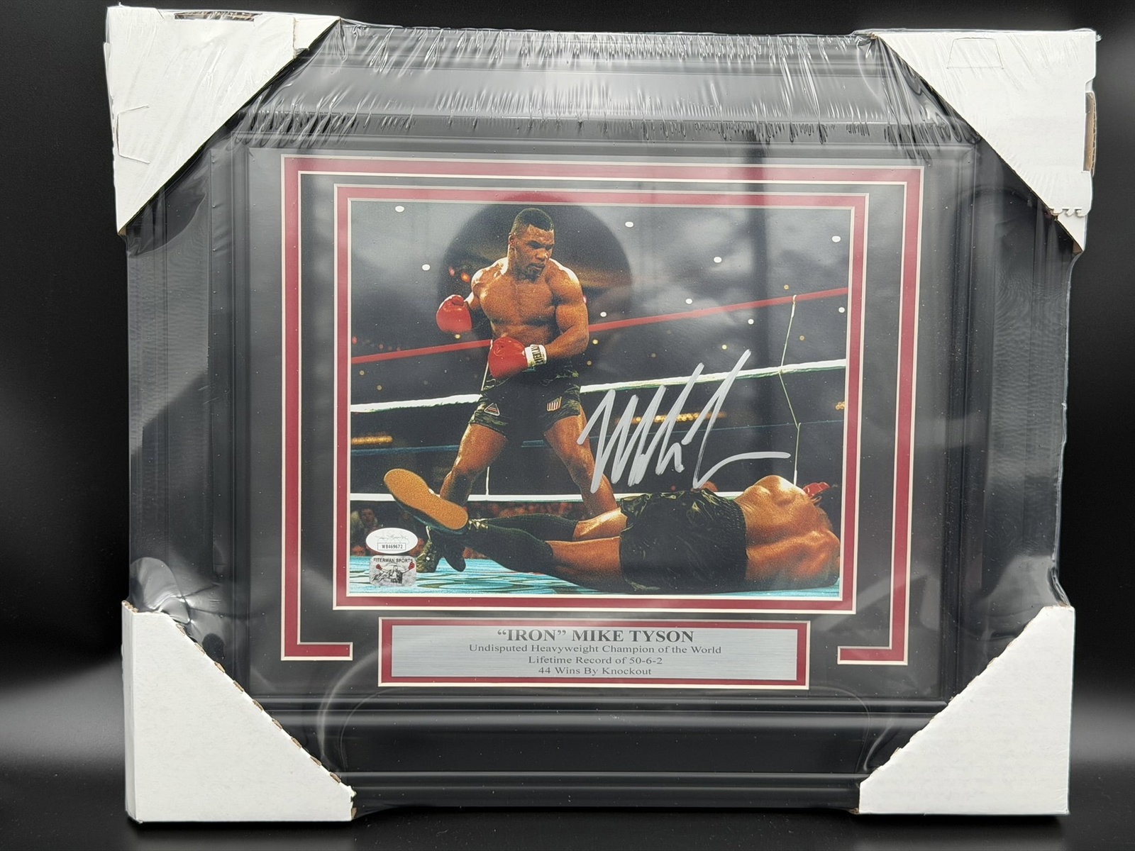 Autographed Mike Tyson Framed 8" × 10" Knockout Photo Display JSA COA: Mike Tyson personally signed professionally framed 8" × 10" color photograph capturing one of the most iconic moments of his legendary boxing career as he stands over a fallen opponent following