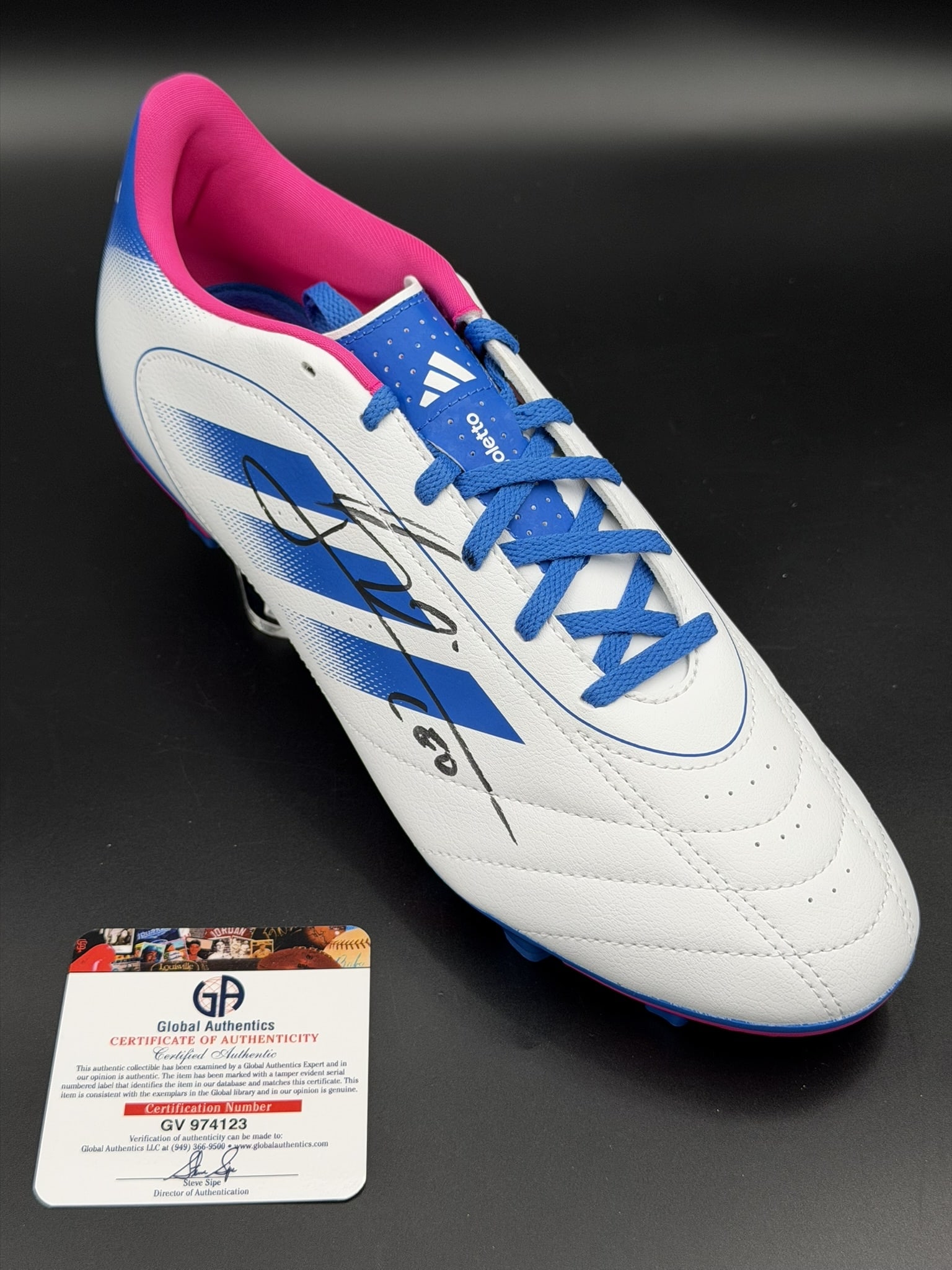 Lionel Messi Signed adidas Soccer Cleat GA COA NWOT: Official adidas soccer cleat personally signed by Lionel Messi in black marker. The cleat features adidas three-stripe styling, white, blue, and pink colorway, molded cleat sole, and Messi-style heel 