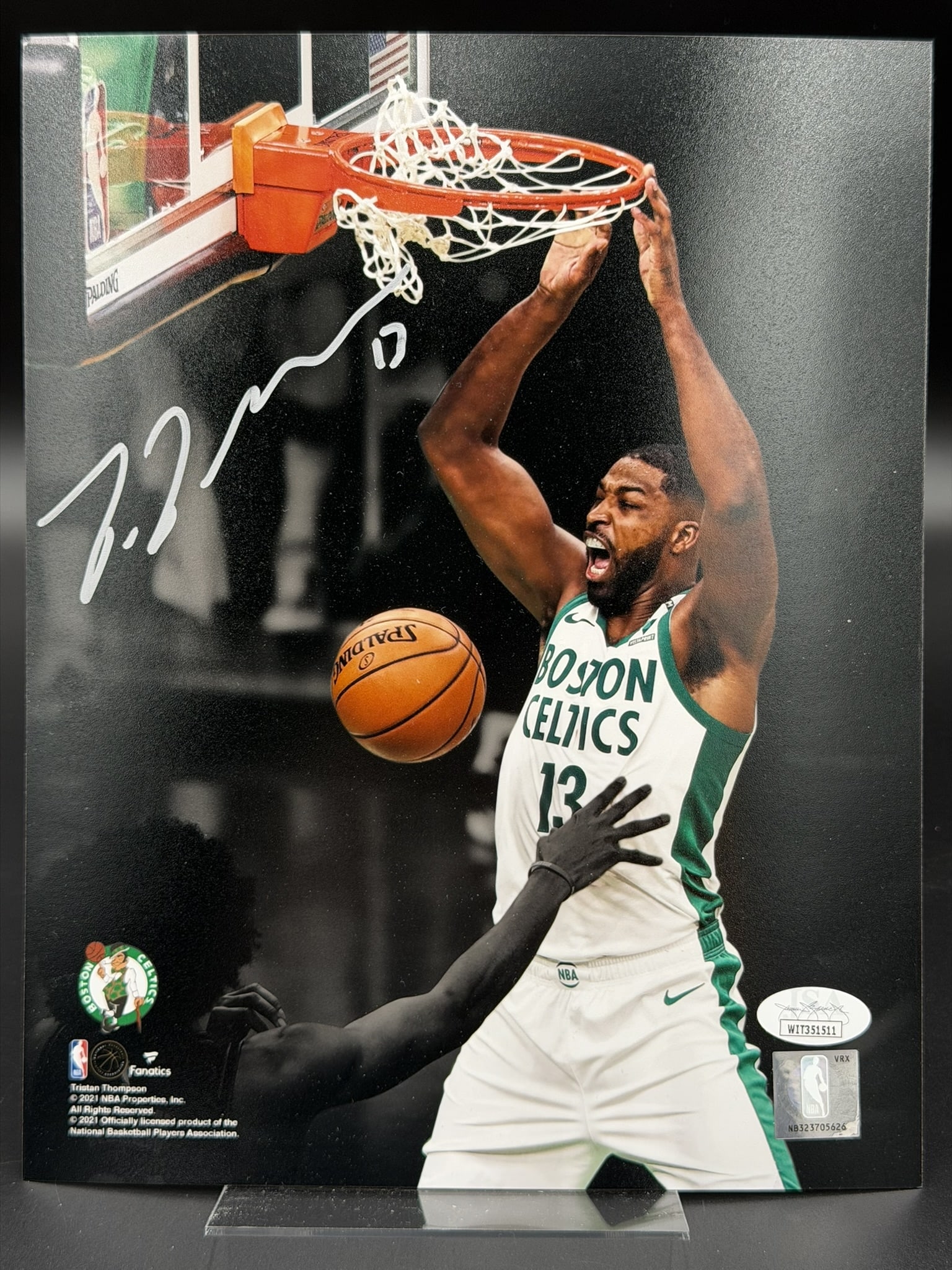 Autographed Tristan Thompson Boston Celtics 8" × 10" Photo JSA COA: Tristan Thompson personally signed 8" × 10" color photograph featuring the Boston Celtics center delivering a powerful two-handed dunk during NBA action. The dynamic image has been signed in sil