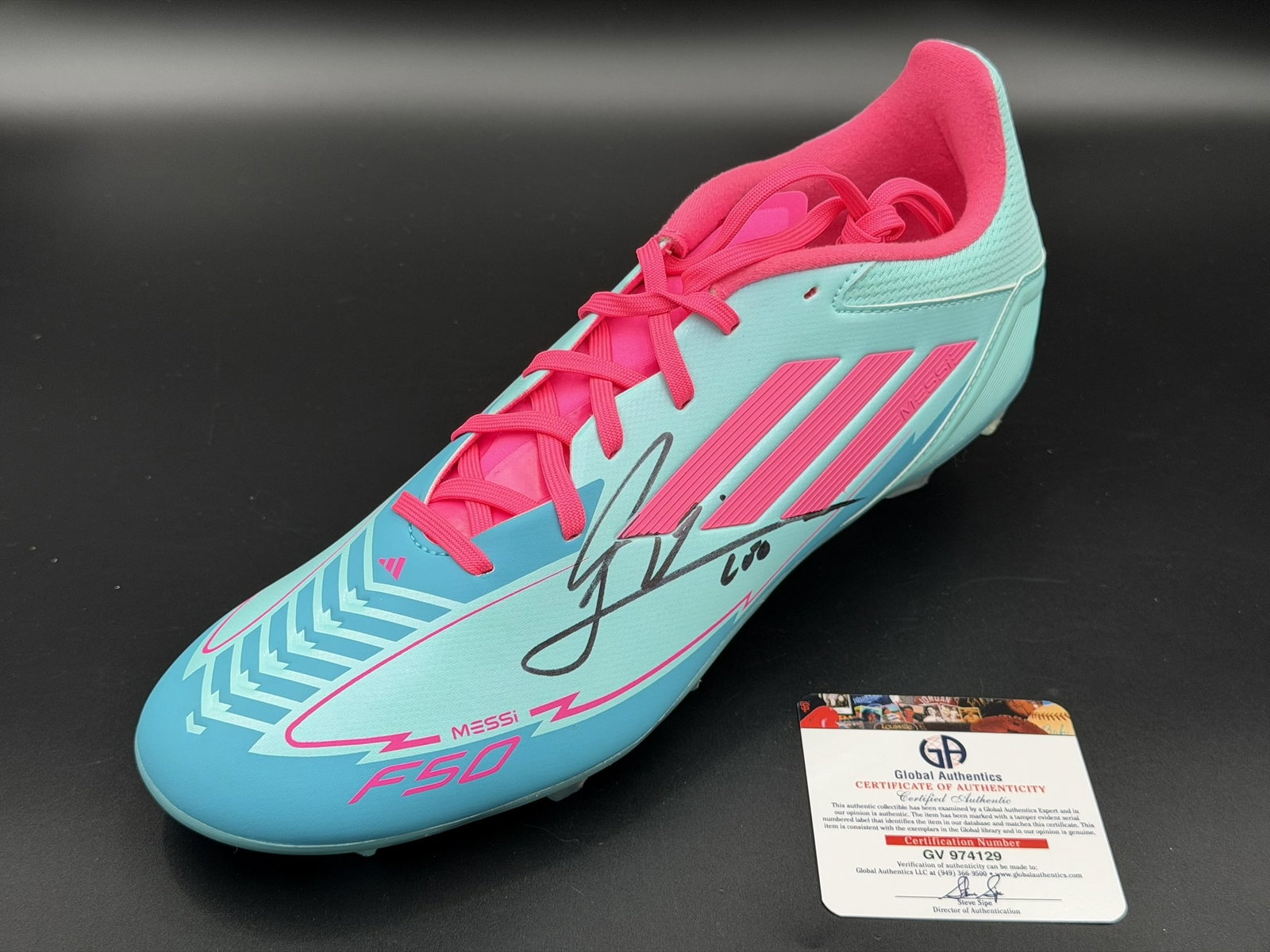 Lionel Messi Signed adidas Soccer Cleat GA COA NWOT: Official adidas soccer cleat personally signed by Lionel Messi in black marker. The cleat features adidas three-stripe styling, aqua and pink colorway, molded cleat sole, and Messi-style heel detailin