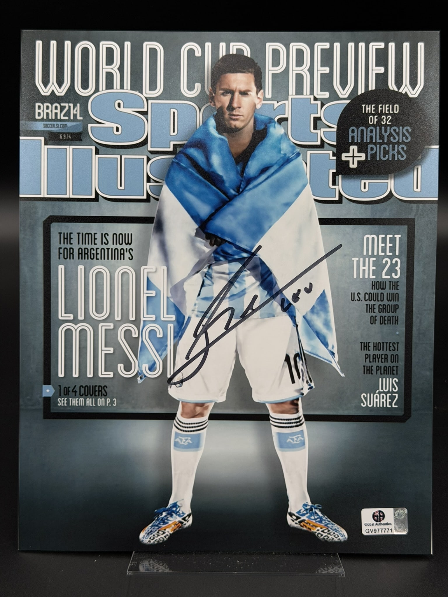 Lionel Messi Signed Sports Illustrated World Cup Preview Cover Photo GA COA 8" × 10": Official color photograph personally signed by Lionel Messi in bold black marker across the front. The striking image reproduces the iconic Sports Illustrated World Cup Preview cover featuring Messi d