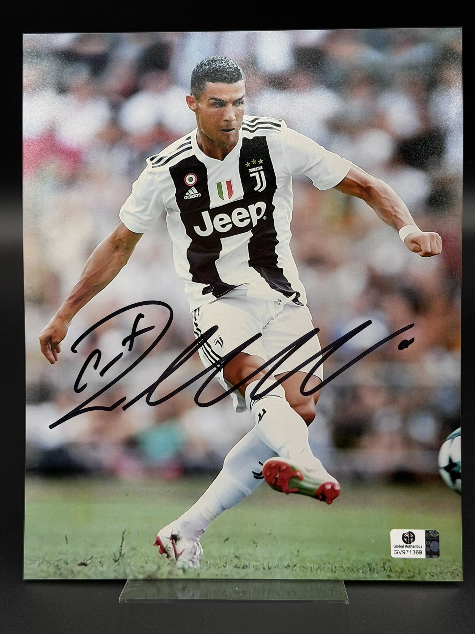 Cristiano Ronaldo Signed Juventus FC 8" × 10" Photo w/ COA: Autographed 8×10 photograph of Cristiano Ronaldo in his Juventus FC kit. Signed during his Serie A era, this piece captures one of the most recognizable players in modern football. Highlights Si
