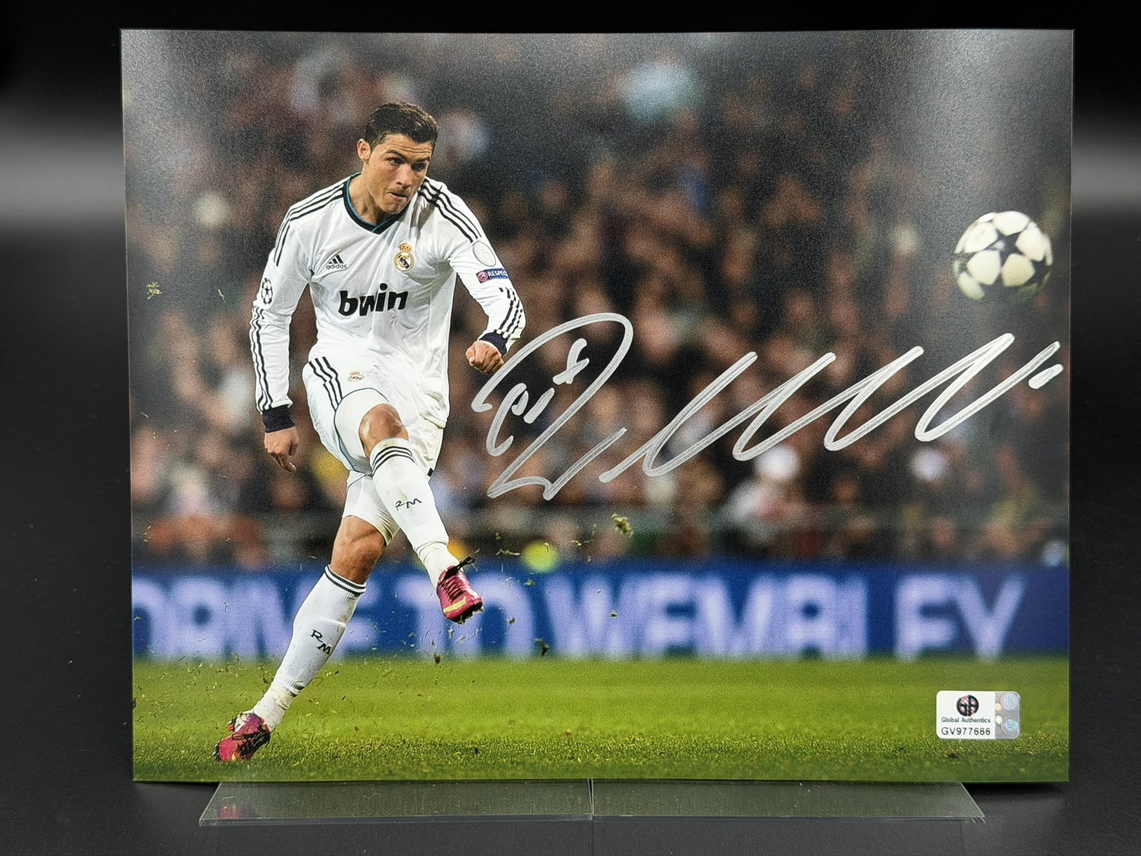 Cristiano Ronaldo Signed Real Madrid Photo GA COA 8" × 10": Color Real Madrid action photograph personally signed by Cristiano Ronaldo in silver marker. The image depicts Ronaldo in match play wearing a Real Madrid kit and is printed on Fujifilm Crystal Archiv