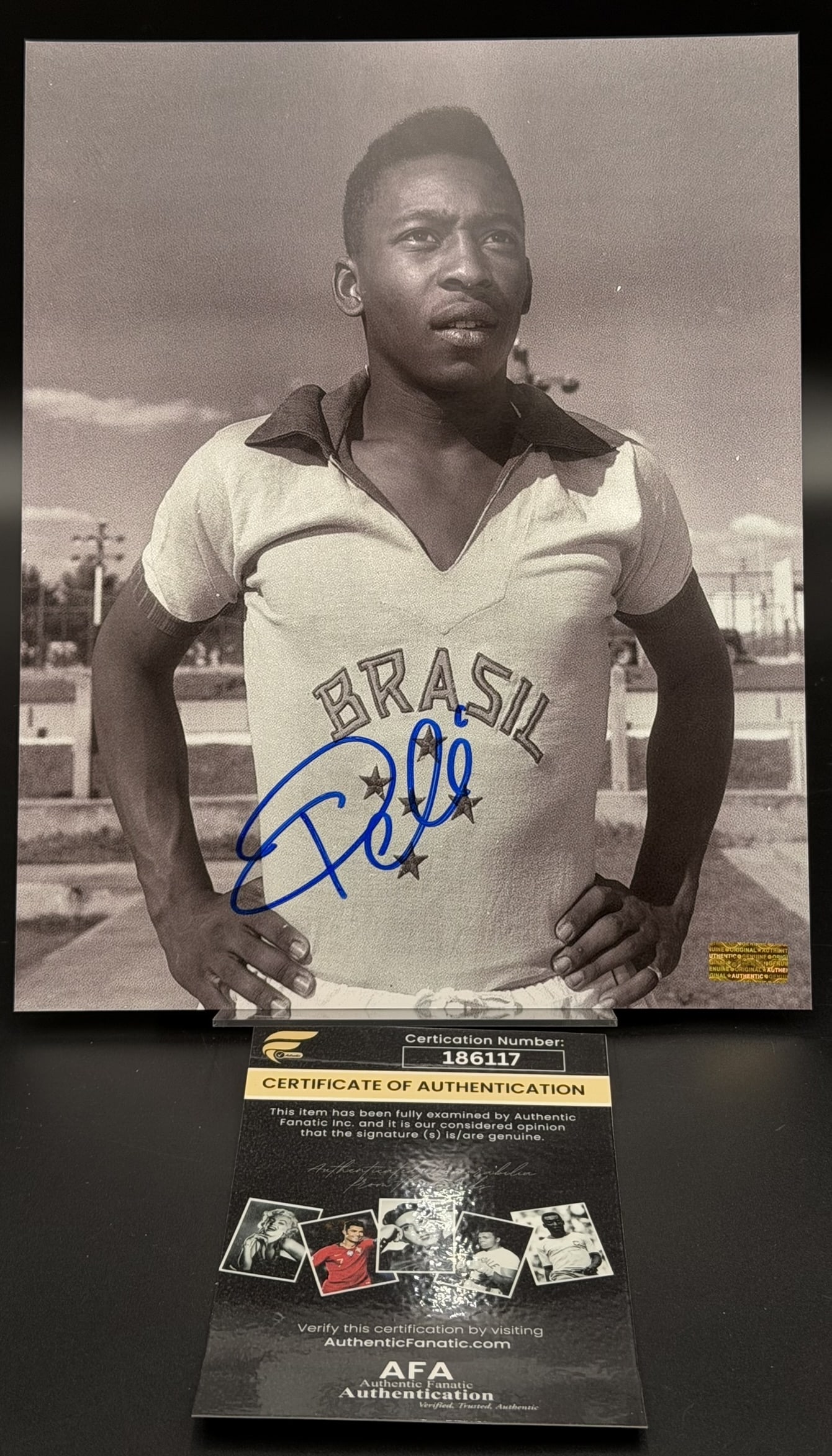 Pelé Hand-Signed Brazil Vintage Photo AFA COA Rare 8" × 10" Collectible: Spectacular 8" x 10" vintage photograph personally hand signed by the legendary <b>Pel&eacute;</b> in bold blue marker across the front. The autograph has been fully authenti