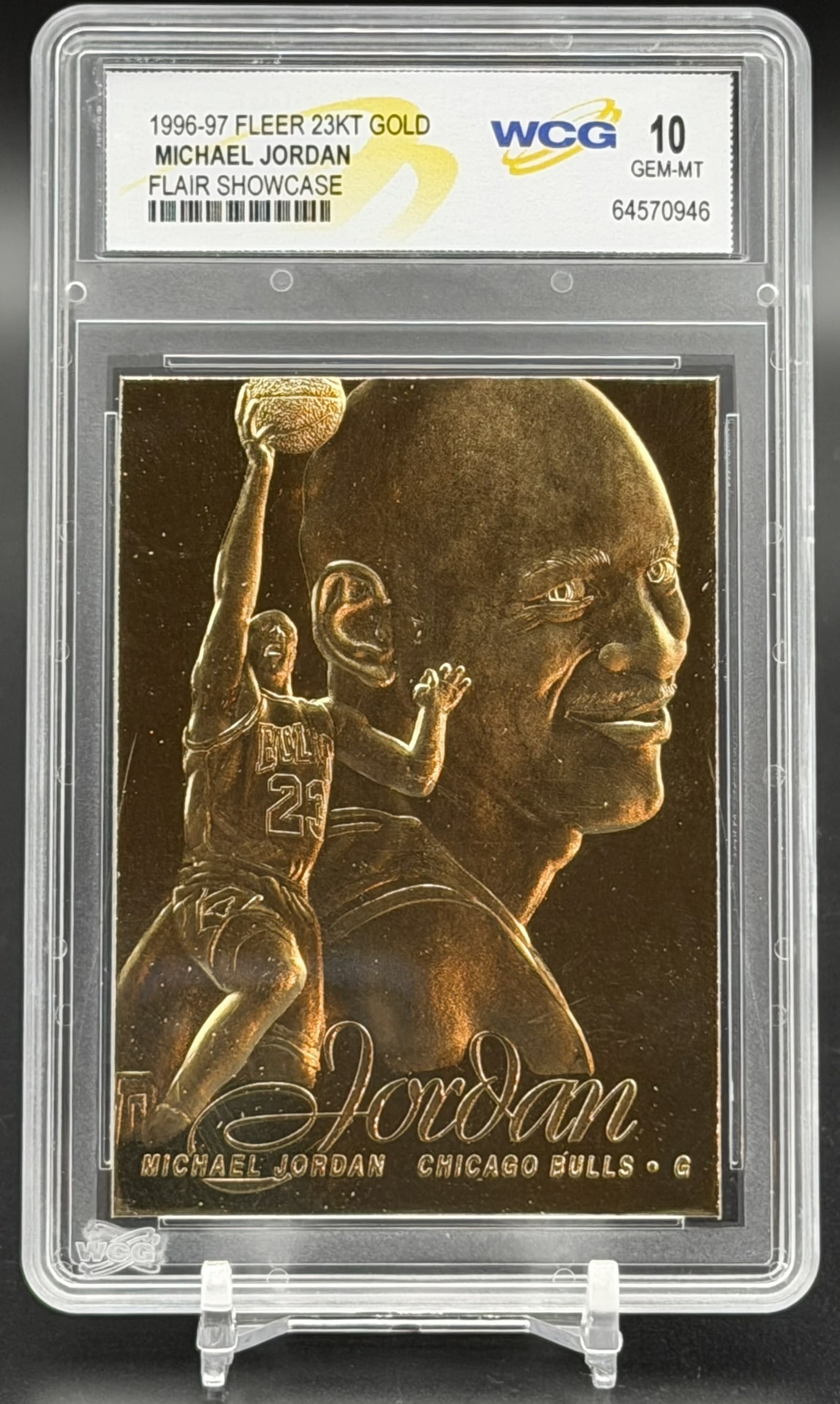 1996 Fleer Flair Showcase Michael Jordan 23KT Gold WCG GEM MT 10 Rare Commemorative: An exceptional sports collectible: a pristine WCG GEM MINT 10 example of Michael Jordan’s 1996–97 Fleer Flair Showcase 23KT Gold commemorative. The composition features a sophisticated dua
