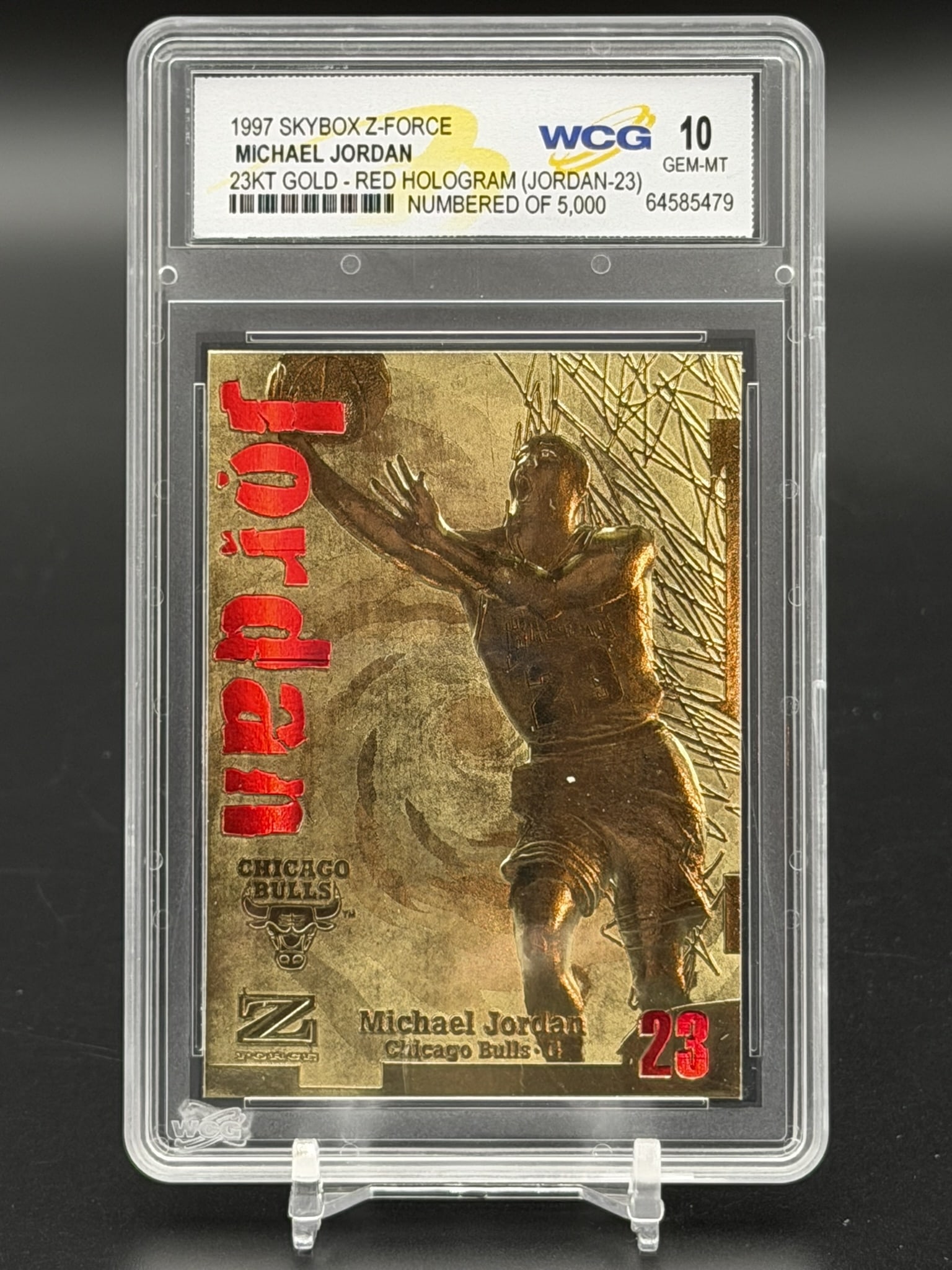 1997 Skybox Z-Force Michael Jordan 23KT Gold Red Hologram /5000 WCG GEM MT 10 Chicago Bulls Card: Vintage 1997 SkyBox Z-Force Michael Jordan 23KT Gold "Red Hologram" insert parallel card, professionally graded WCG Gem-MT 10. The front of this premium metallic collectible features a gold-sculpted r