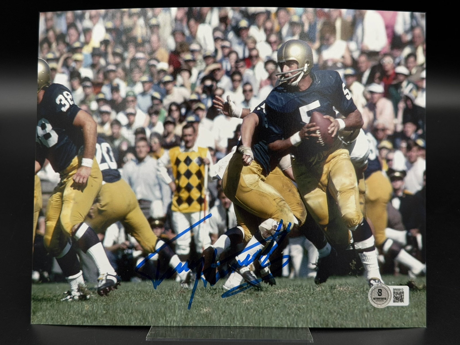 Autographed Terry Hanratty Notre Dame Fighting Irish 8" × 10" Photo Beckett COA: Terry Hanratty personally signed 8" × 10" color photograph depicting the legendary Notre Dame Fighting Irish quarterback dropping back to pass during his collegiate career. Signed boldly in blue