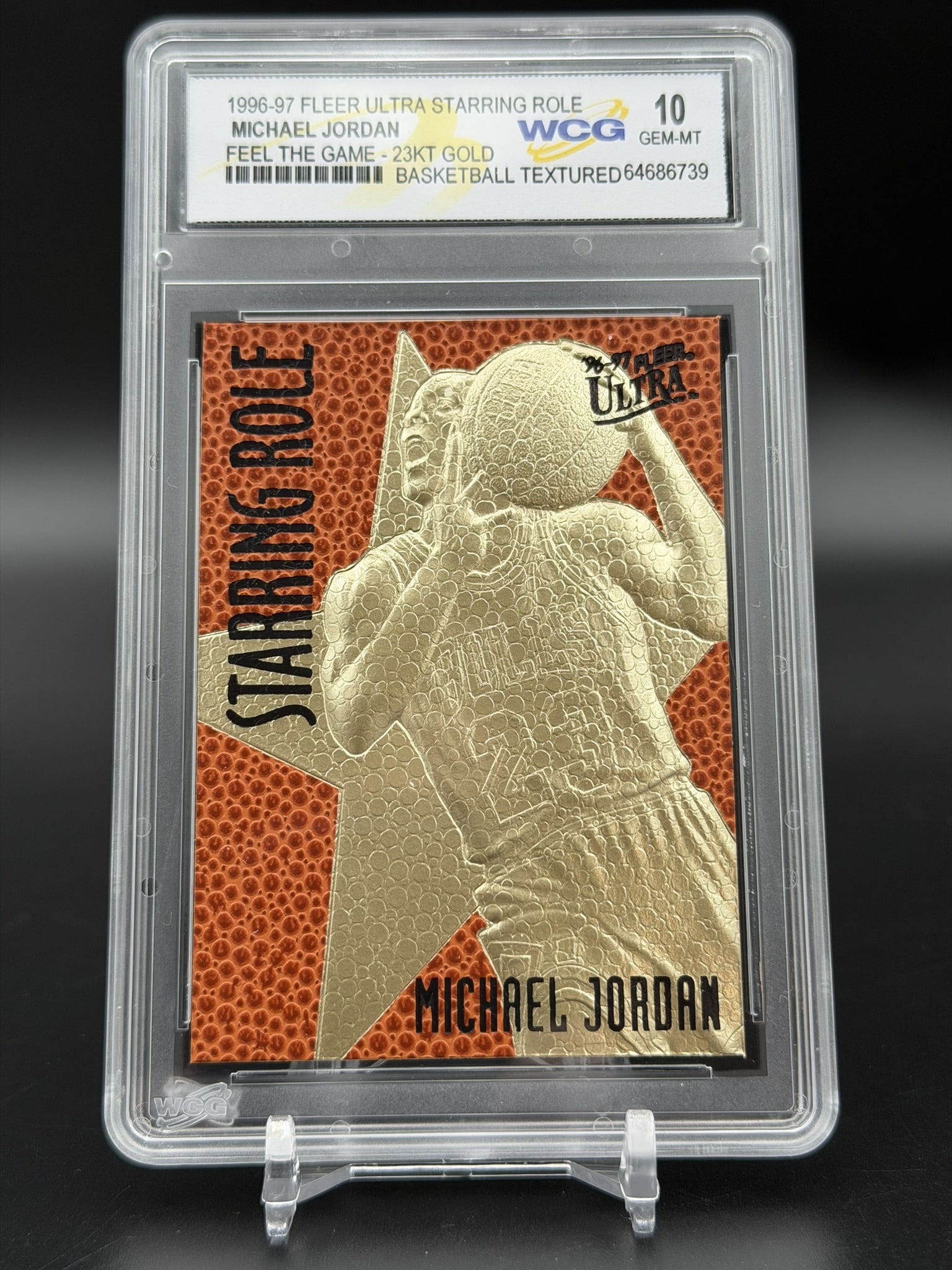 1996-97 Fleer Ultra Starring Role Michael Jordan 23KT Gold Feel The Game WCG GEM MT 10 Card: An exceptional sports collectible: a pristine WCG GEM MINT 10 example of Michael Jordan’s 1996–97 Fleer Ultra Starring Role "Feel The Game" 23KT gold commemorative. The composition feature