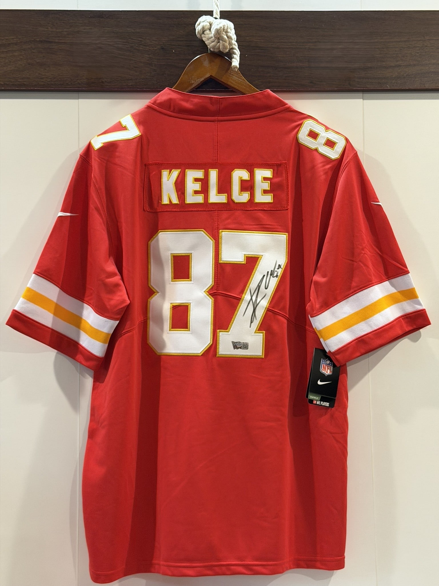 Travis Kelce Signed Chiefs #87 Nike NFL Jersey ACE COA Sz L NWT: Official Nike Kansas City Chiefs NFL jersey personally signed by Travis Kelce in black marker across the reverse number "87." The jersey features Kelce nameplate, player number 87, Nike On Field const