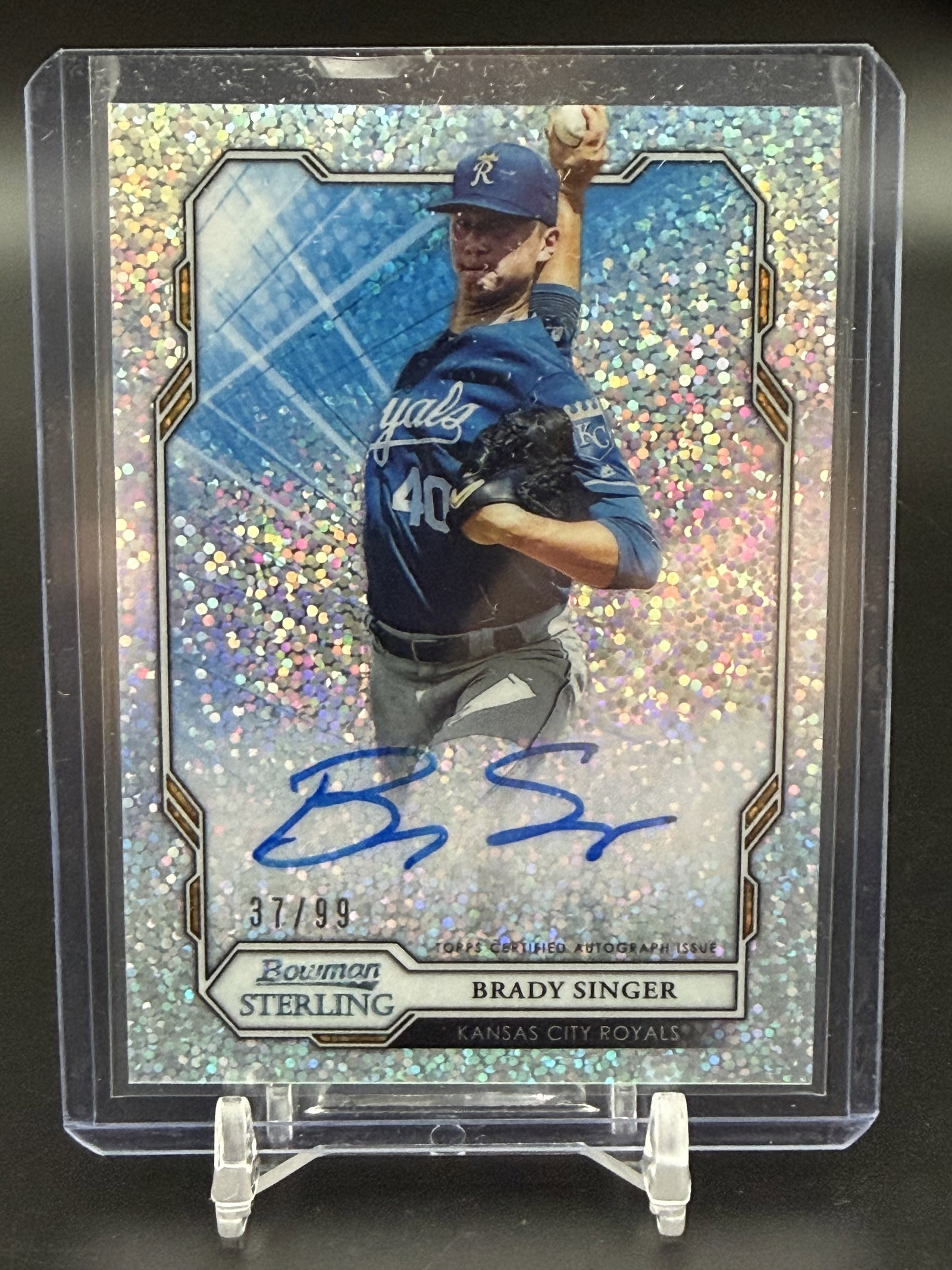2019 Bowman Sterling Brady Singer Rookie Autograph Refractor #BSPA-BS /99 Kansas City Royals: Official 2019 Bowman Sterling Refractor Autograph card featuring Brady Singer of the Kansas City Royals. This on-card prospect autograph is individually serial-numbered 37/99 and bears a certified blu
