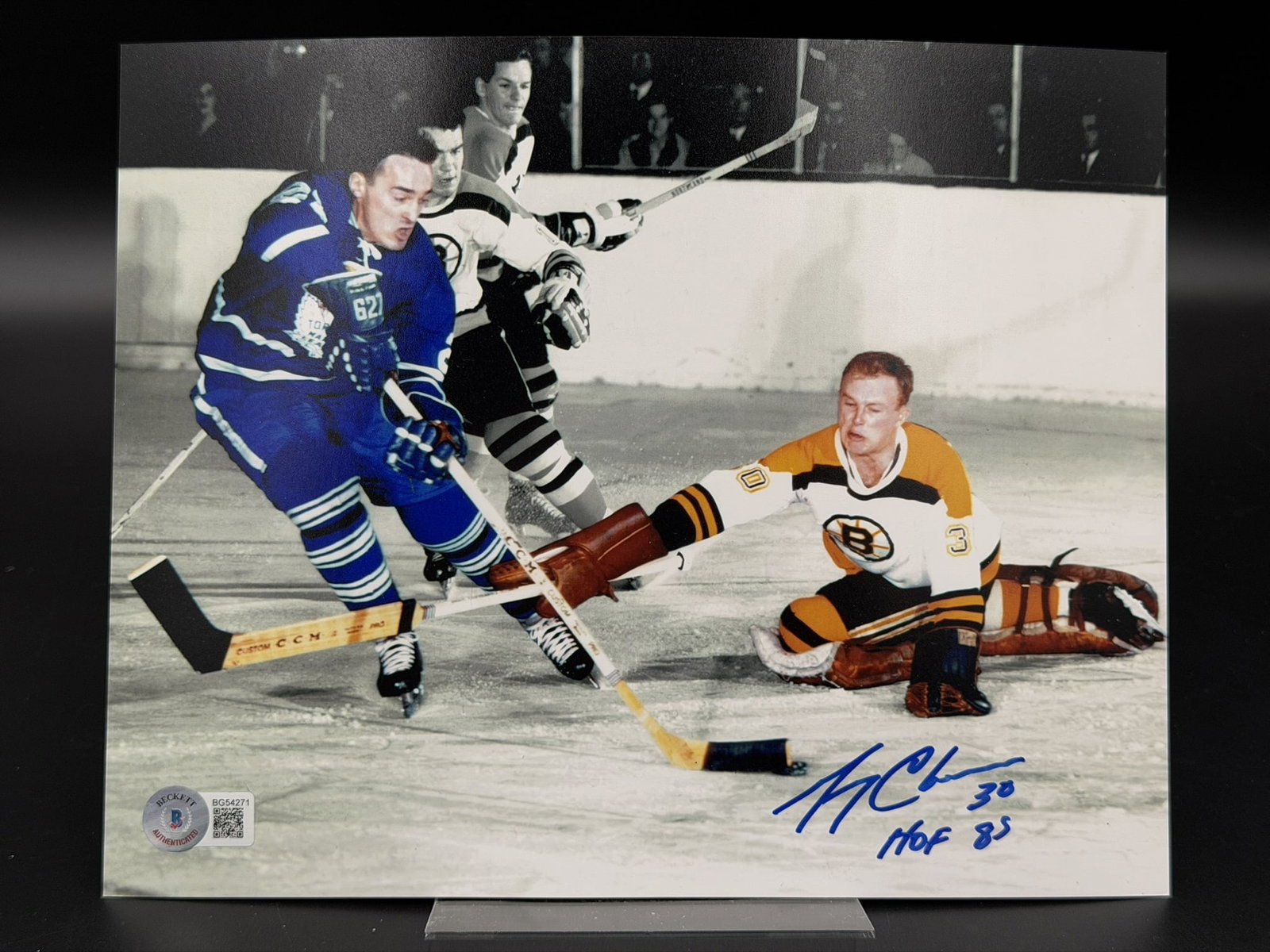 Autographed & Inscribed Gerry Cheevers Boston Bruins 8" × 10" Photo Beckett COA: Color photograph personally signed by Boston Bruins Hall of Fame goaltender Gerry Cheevers in bold blue marker. Cheevers has additionally inscribed the photograph with his jersey number "30" and "HOF 