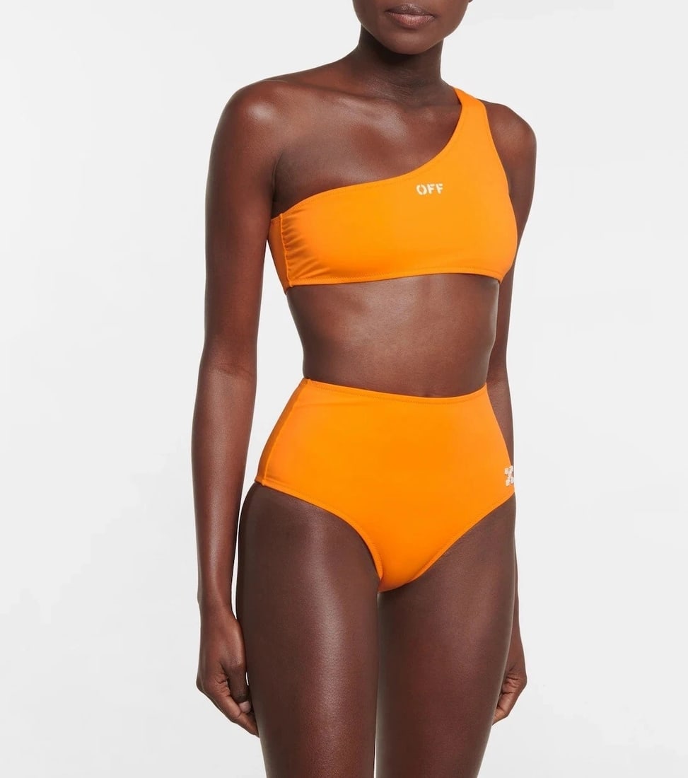 IMPORTED MSRP €490 OFF-WHITE Main Logo One-Shoulder Bikini Set Size US6 / S Orange Made in: OFF-WHITE Main Logo bikini set crafted in Italy from a stretch polyester blend featuring a vibrant orange colorway with contrasting white logo accents. This two-piece swimwear set includes a one-shoul