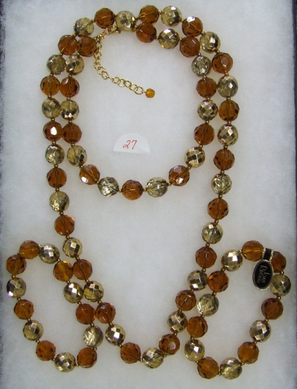 Joan Rivers Glass Bead Necklace and Bracelet Set: 36" Amber and gold glass bead necklace w/2 matching stretch bracelets.