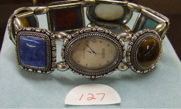 Ecclissi Western-Style Sterling Silver Watch : Sterling silver western-style stretch bracelet watch with stones. The stones include tiger-eye, turquoise, mother-of-pearl, coral, agate, and lapis. TTOW of 2.03 with stones; original box.