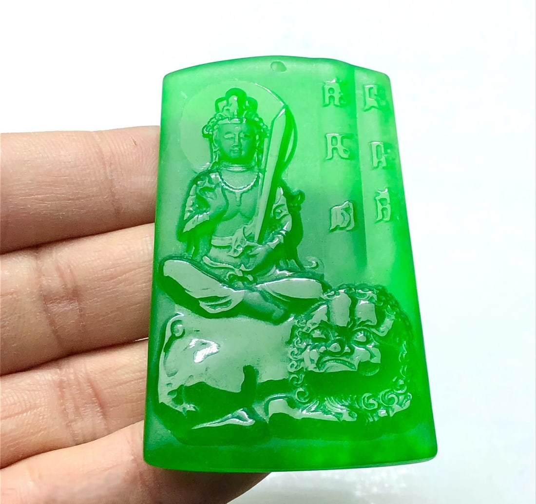 Imperial Green High-Ice Perfect Jadeite Frosted Guanyin Pendant: This is a high-quality, flawless, imperial green jadeite Guanyin pendant with a frosted finish. Made from superior materials, it is icy and translucent with a beautifully carved face, exquisite relief