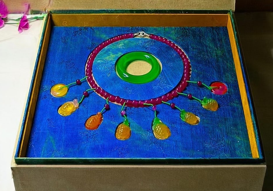 A box of old jadeite necklaces and bracelets (1 of 9)