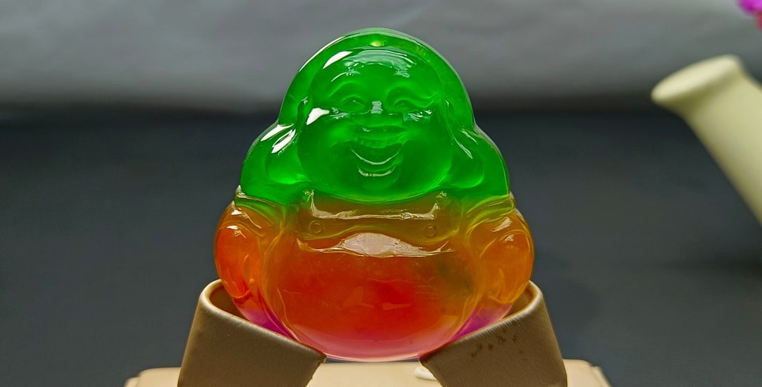 Top-grade dragon stone variety, colorful, extra-large and extra-thick jadeite Maitreya Buddha: Top-grade dragon stone variety, multicolored, extra-large and extra-thick jadeite Maitreya Buddha, excellent translucency, absolutely perfect. Provenance:Private collection, Warsaw , Poland. Our coope