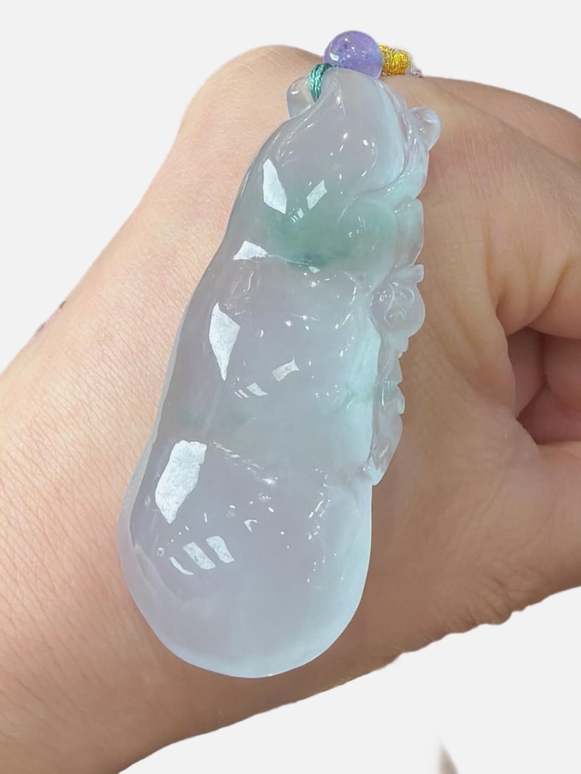 Jadeite Icy Type with Floating Flower Pattern (Lucky Bean): Jadeite bean-shaped with floating flowers, icy and translucent, finely carved, three-dimensional and full, top-quality jadeite. Provenance:Private collection, Moscow, Russia. Our cooperative logistics