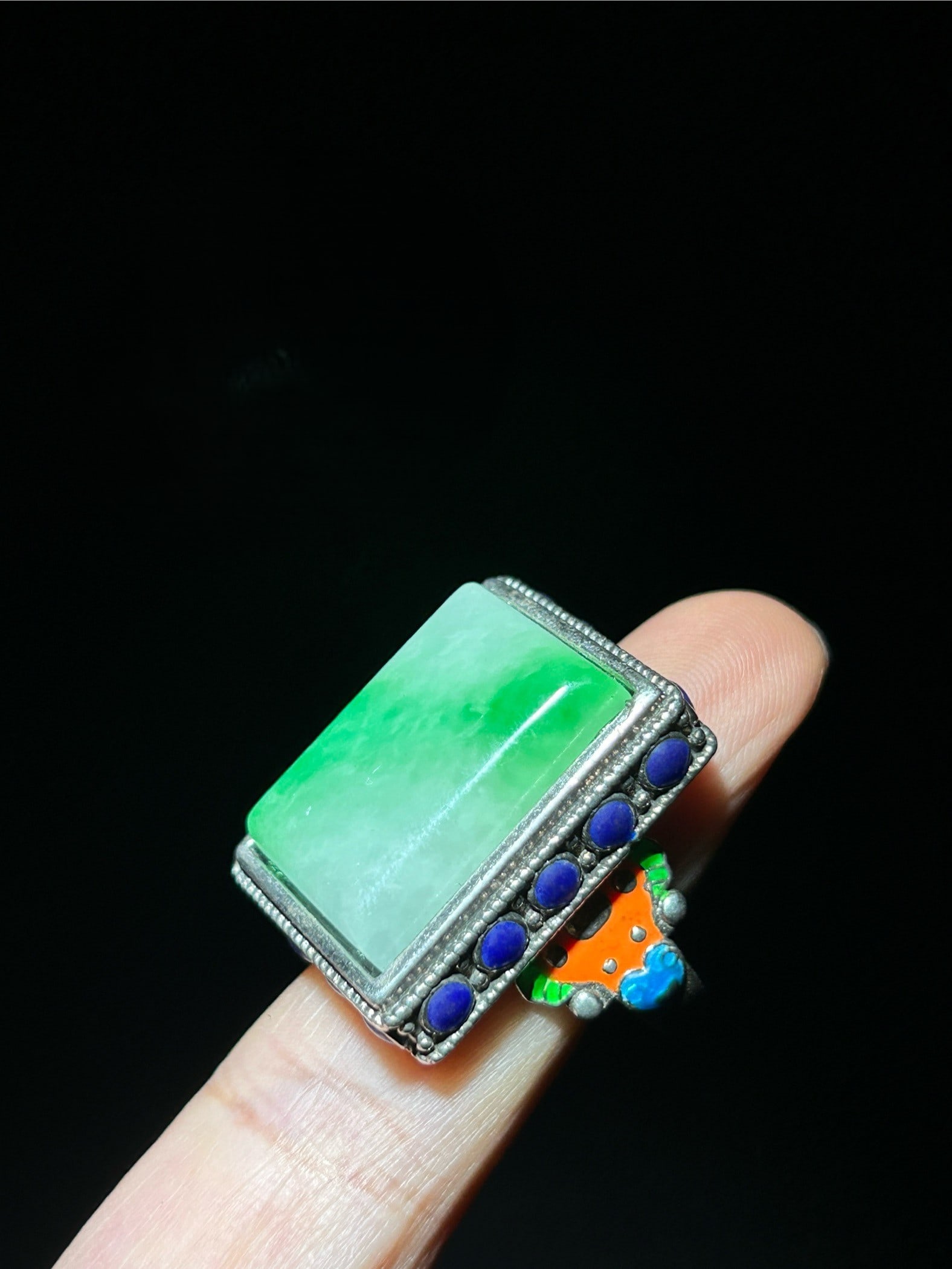 A cloisonne enamel ring with a silver setting inlaid with jade.: A cloisonne ring with a silver setting inlaid with jade. Provenance:Private collection from a professor in Lomonosov Moscow State University. Our cooperative logistics services provider expertly handl