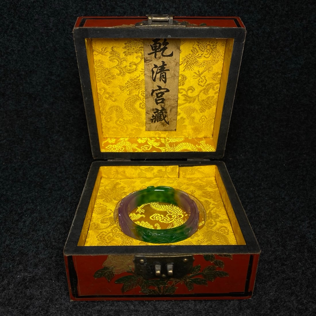 A finely crafted jade bracelet is housed inside a lacquerware collection box made by the Qianlong (1 of 9)