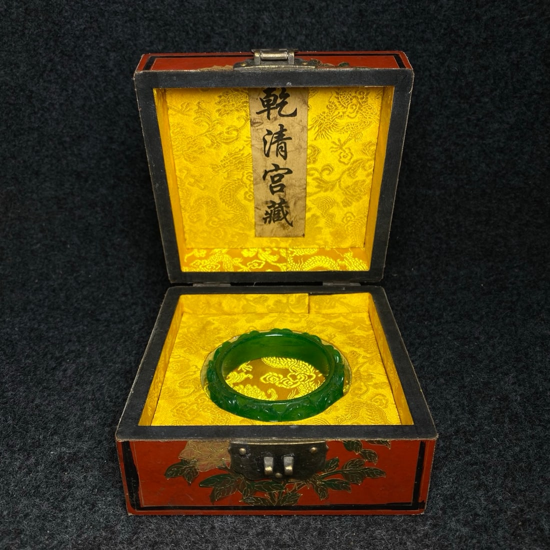 A finely crafted jade bracelet is housed inside a lacquerware collection box made by the Qianlong (1 of 9)