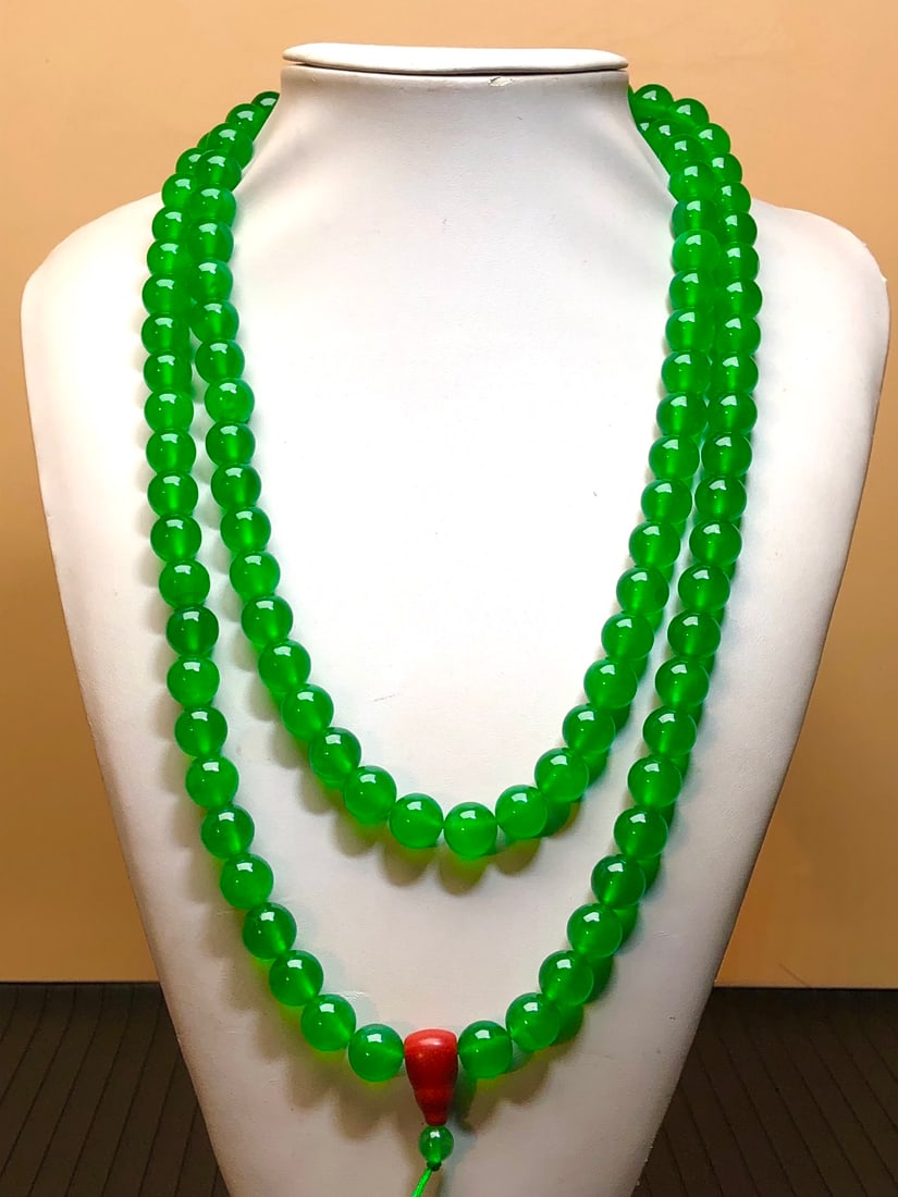 A necklace of imperial green high-ice jadeite beads (1 of 8)