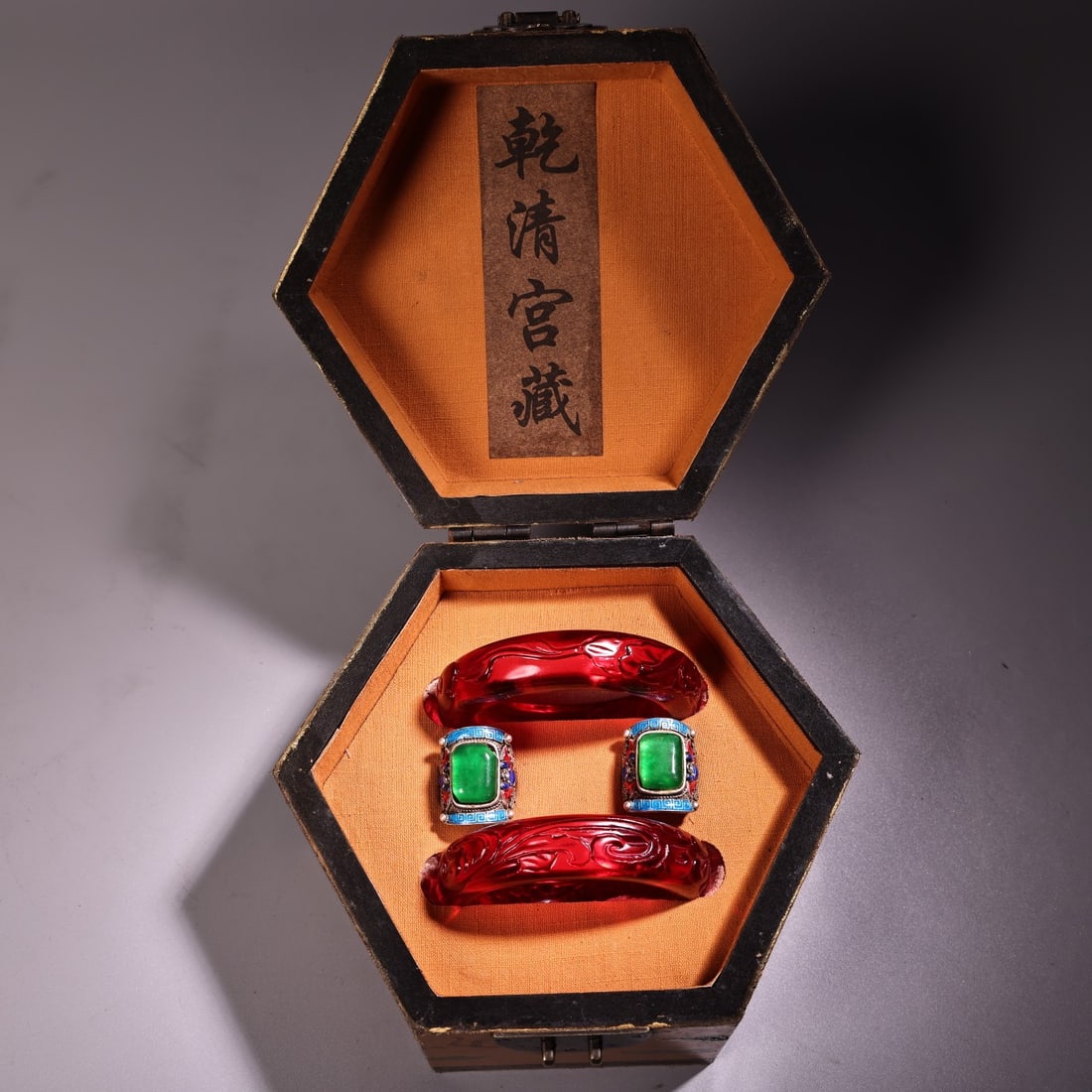Rarely collected items include a carved ruby bracelet, a jade ring, and a box of other jewelry. (1 of 13)