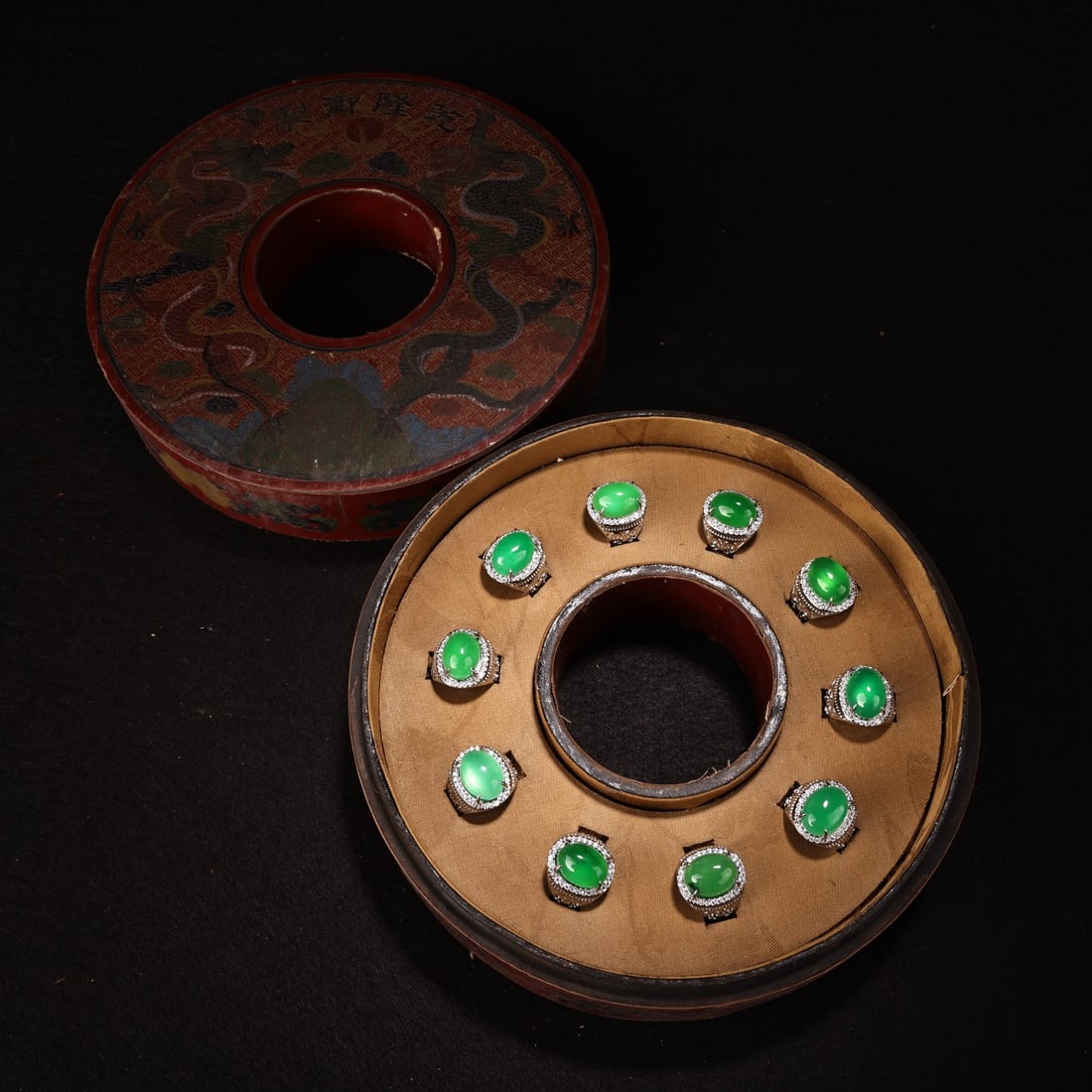 A box containing an exquisite and rare high-quality, icy green jadeite ring crafted using (1 of 8)