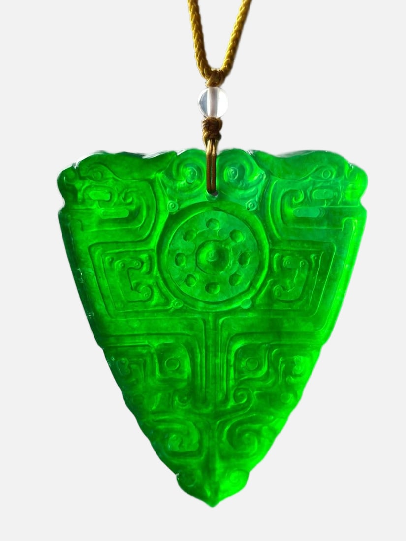 High-Ice Imperial Green Dragon Stone Jade Pendant: High-grade imperial green dragon stone jadeite pendant, can withstand ultraviolet light. Provenance:From an old private collection in Hessen, Germany. An Austrian collector, acquired from the above. O
