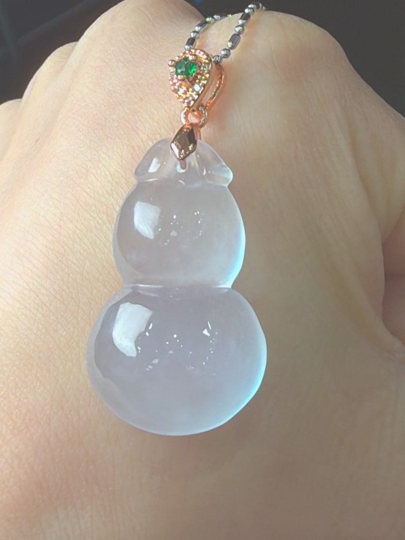 Jadeite Icy Gourd: This jadeite gourd is of the icy type, translucent and lustrous, finely carved, thick and full, with excellent texture and translucency. Provenance:Private collection in Geneva, Switzerland. Private c