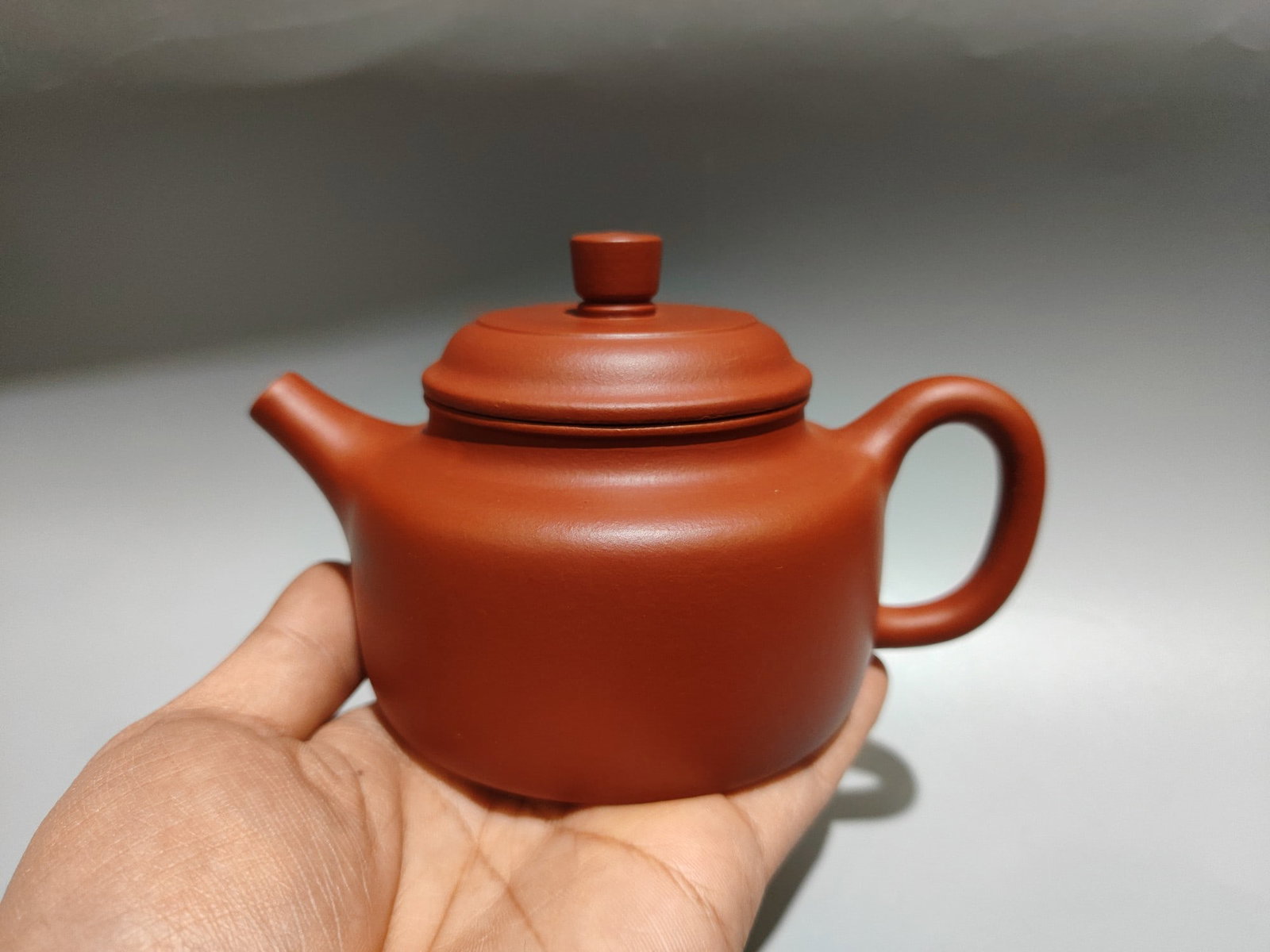 Product Name: Dezhong Teapot: Product Name: Dezhong Teapot; Bottom Mark: Made by Wan Xiuping; Size: 15 x 9 cm; Capacity: 320cc; Clay: Original Da Hong Pao Clay Provenance:From an old private estate in Paris, France. The private co
