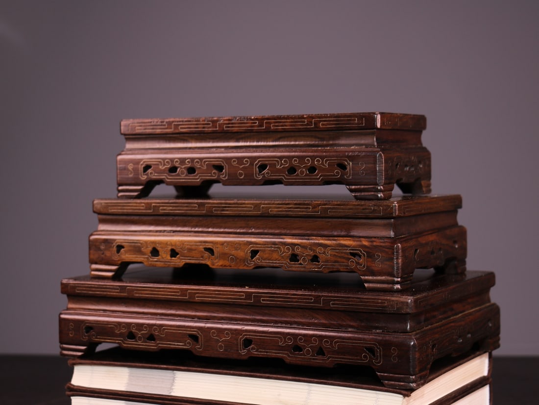 Rare antique rosewood base inlaid with silver wire: This set of three exquisite antique rosewood bases inlaid with silver wire features rosewood with high oil content and hardness. The bases are intricately carved and inlaid with silver wire, resulting