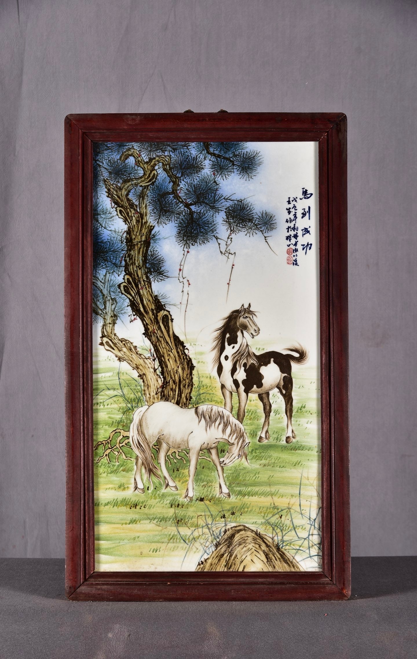 A painting by Wang Bu! A central hanging screen with a rosewood panel inlaid with famille rose: Painted by Wang Bu! A rosewood hanging screen inlaid with famille rose porcelain panels, titled "Success Upon Arrival." Dimensions: 90cm high, 53cm wide. Provenance:Private collection, Vienna, Austria