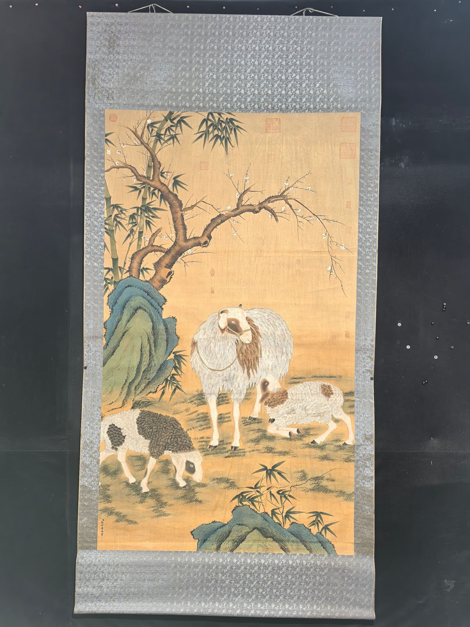 Lang Shining's Three Sheep Bring Prosperity: Eight-foot hanging scroll painting, a hand-painted work by Lang Shining of the Qing Dynasty, featuring the motif of "Three Rams Bringing Prosperity." Material: silk. Actual product photo Image Mounted