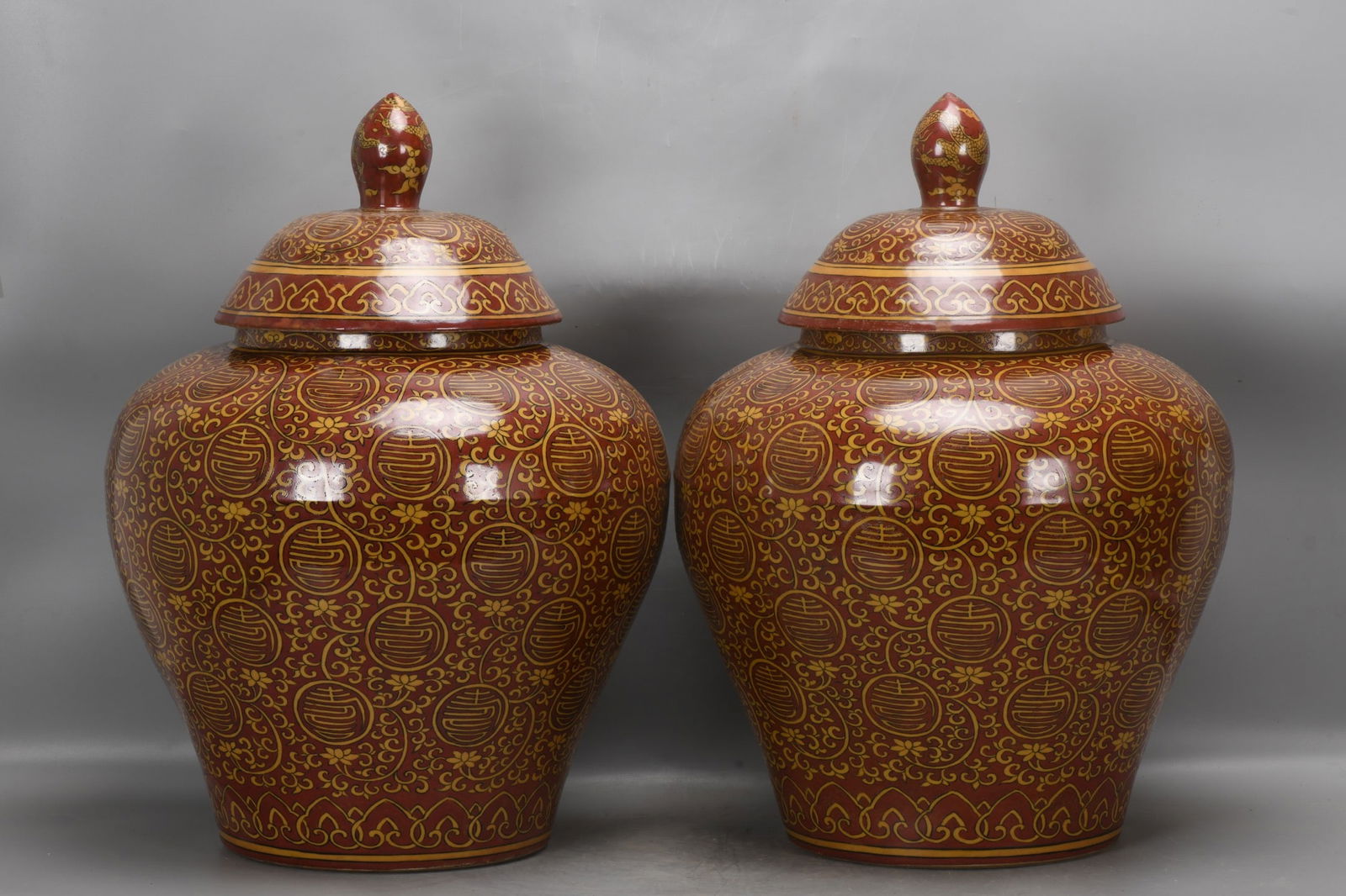 pair of Ming Dynasty, Jiajing period, yellow-and-red longevity character jars: A pair of Ming Dynasty, Jiajing period, yellow-glazed red-character longevity jars, 53 cm high, 21 cm in mouth diameter, 39 cm in belly diameter, and 23 cm in base diameter. Provenance:From an old pri