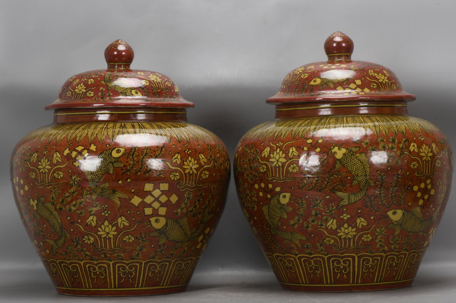 A pair of Ming Dynasty, Jiajing period, yellow-glazed red fish and grass patterned jars (1 of 9)