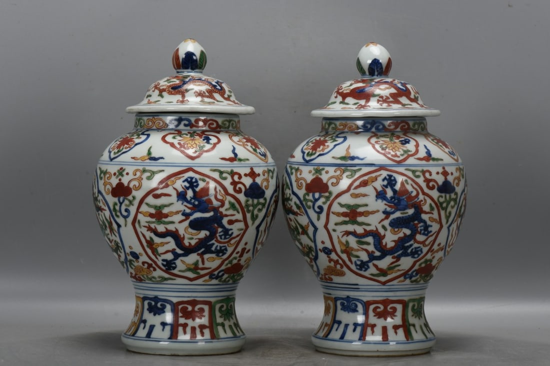 A pair of Ming Dynasty, Jiajing period, blue and white porcelain jars with polychrome floral and (1 of 9)