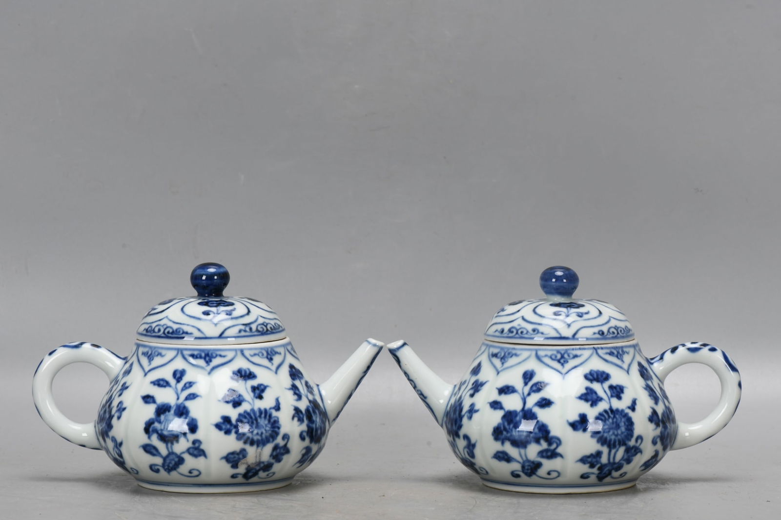 A pair of Ming Dynasty Xuande blue and white floral melon-shaped teapots (1 of 9)